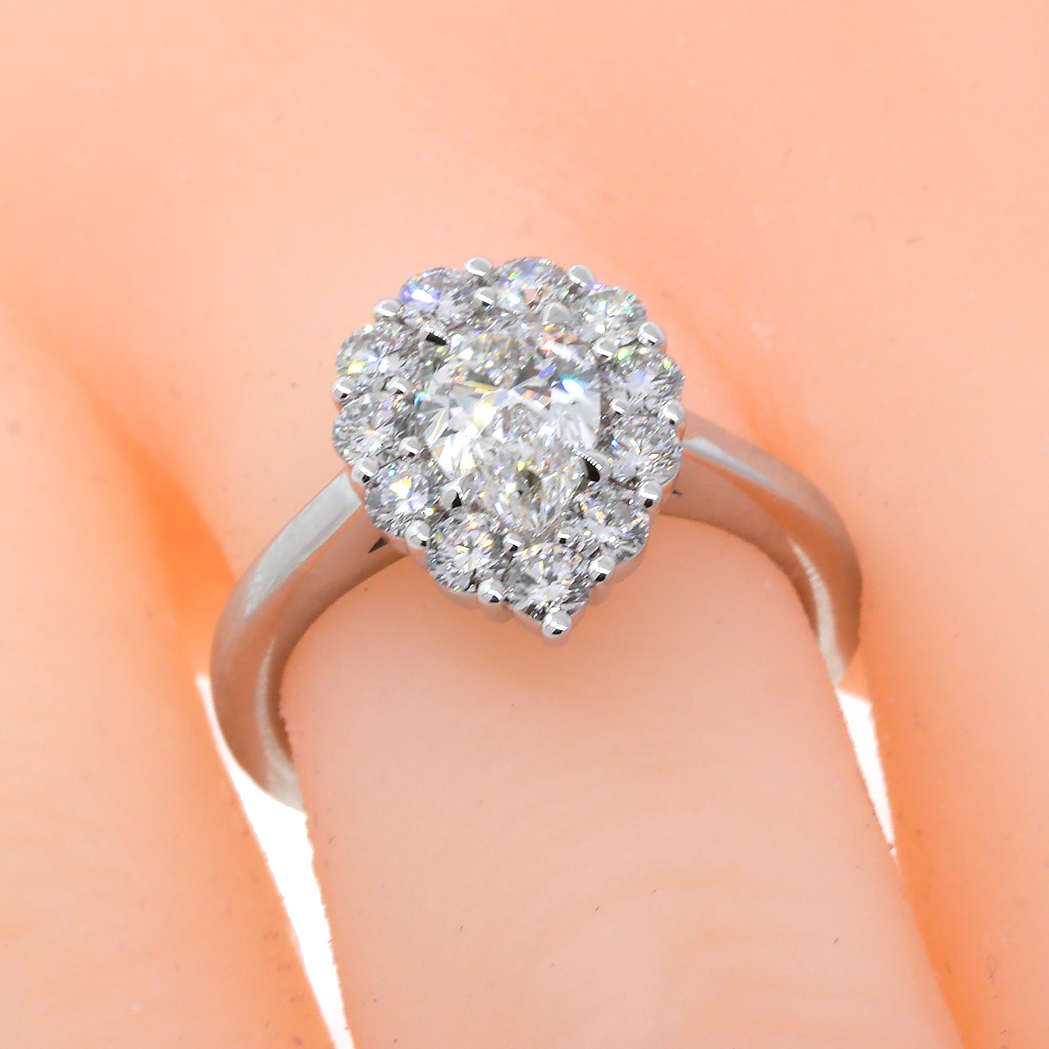 14 kt White Gold
GIA Report Number 6322522341
Pear Shaped Cut = 0.90 ct twd
Color: G
Clarity SI1
Ring Size: 5.5 (resizeable)