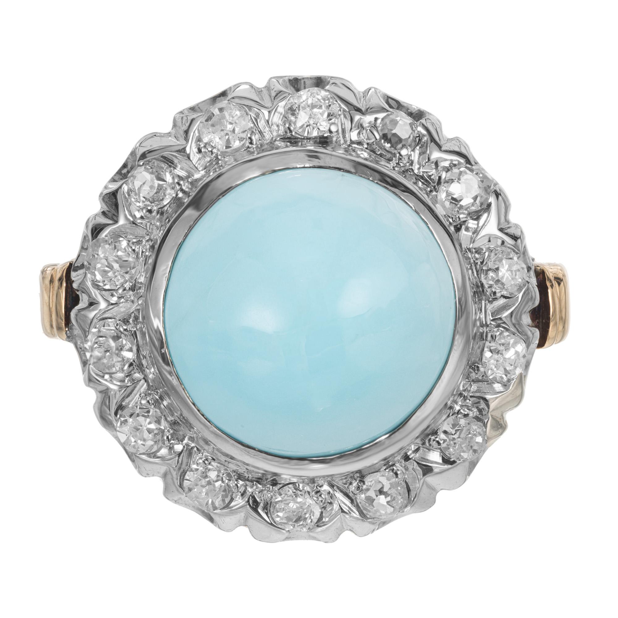 Vintage 1950's Turquoise and diamond cocktail ring. GIA certified round Turquoise mounted in a 14k white gold scallop style crown with a halo of 14 round cut diamonds. The shank of the ring is 14k yellow gold. The GIA has certified the turquoise as