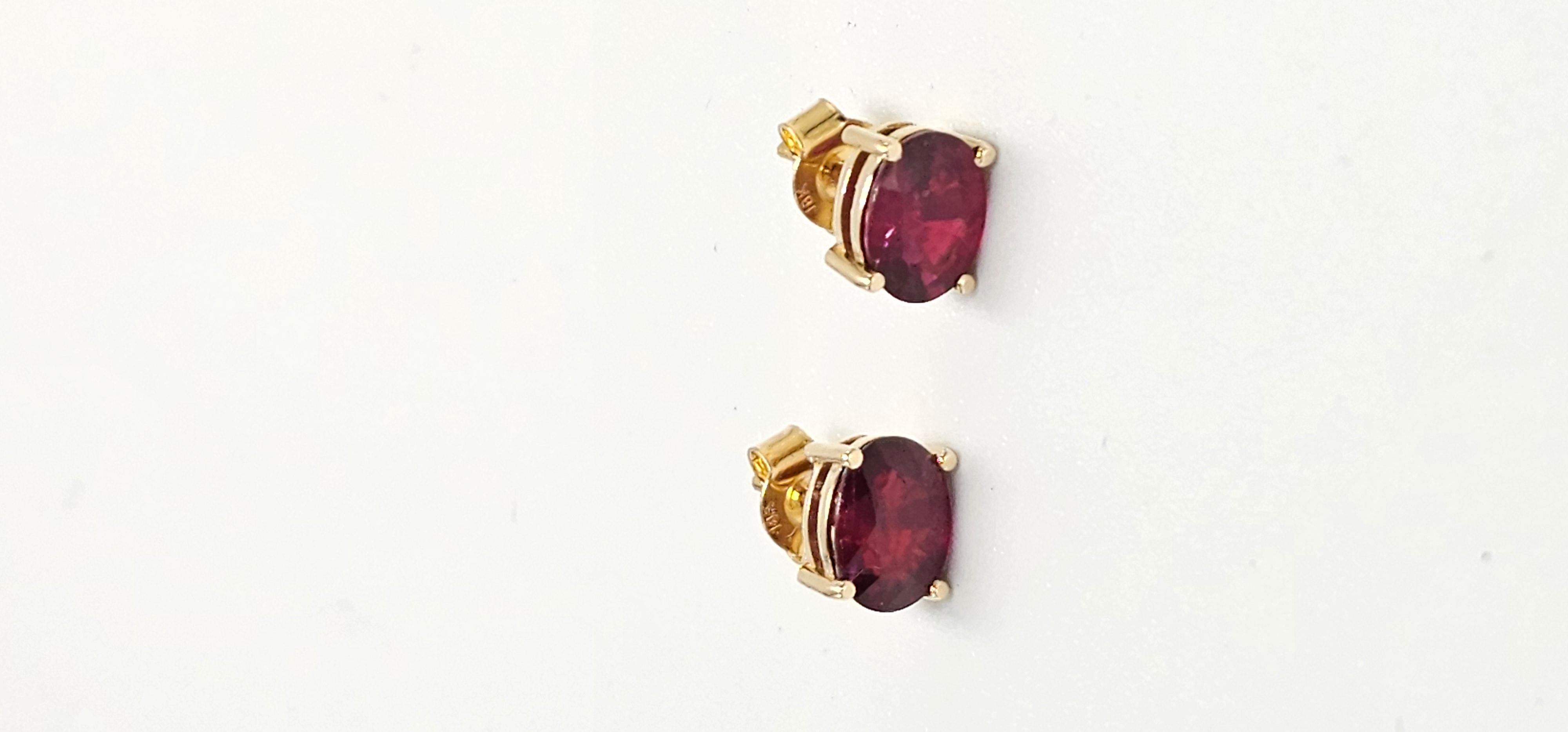  A stunning pair of Pigeon Blood Red Rubies, the most sort after color in Ruby, set in 18k yellow gold. This is a beautiful and amazing piece with vivid color, set in a custom designed earring to enhance the natural beauty!
 Ruby : 1.39 & 1.61 
