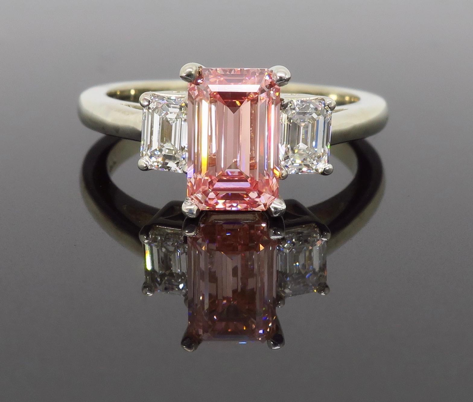 GIA Certified pink and white emerald cut diamond three stone ring crafted in 14k white gold.

GIA Certified: 2185945499
*Copy of electronic certification only*
The diamond is laser inscribed “TREATED COLOR