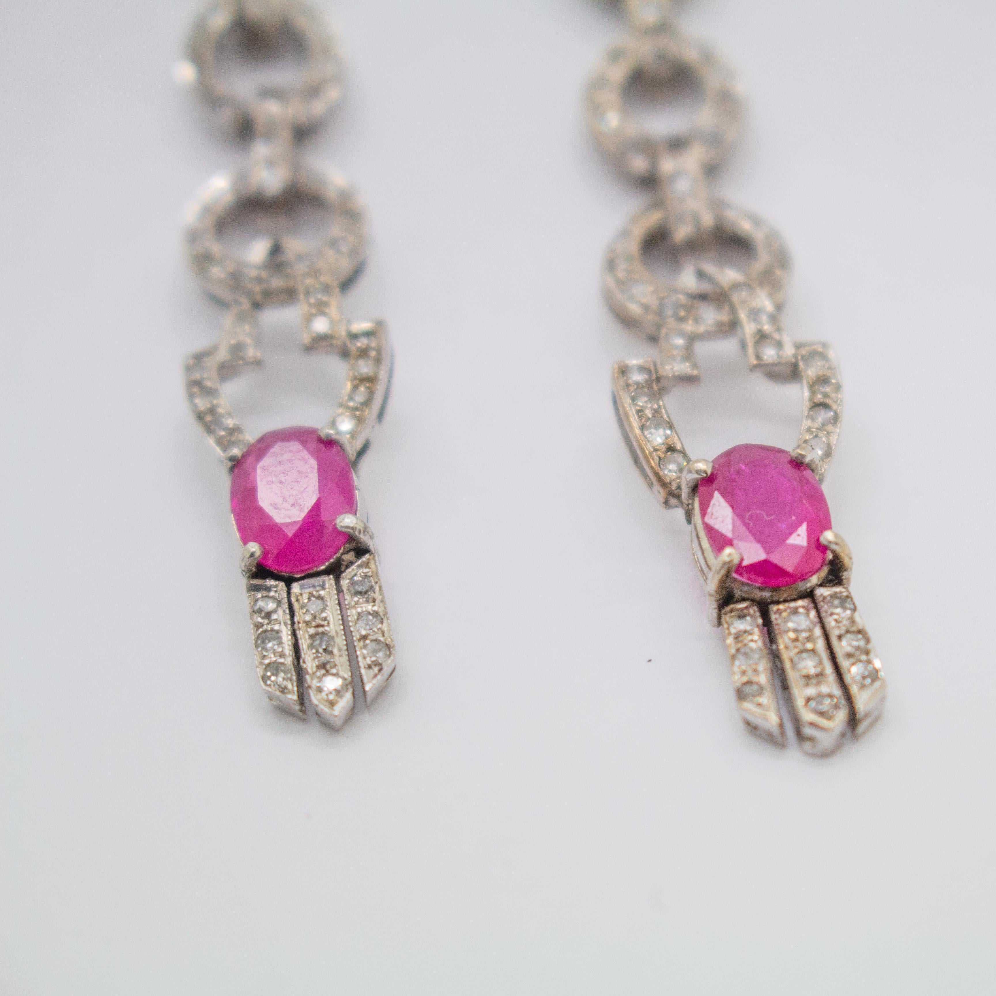 Specifications:
Metal: 14K White Gold
Stone: Pink Ruby
Ruby Weight: 2.14 cttw
Secondary Stone: White Diamond
White Diamond Weight: 0.55 ctw
Color: I
Clarity: SI2
Weight: 13.4g
Style: Art-Deco