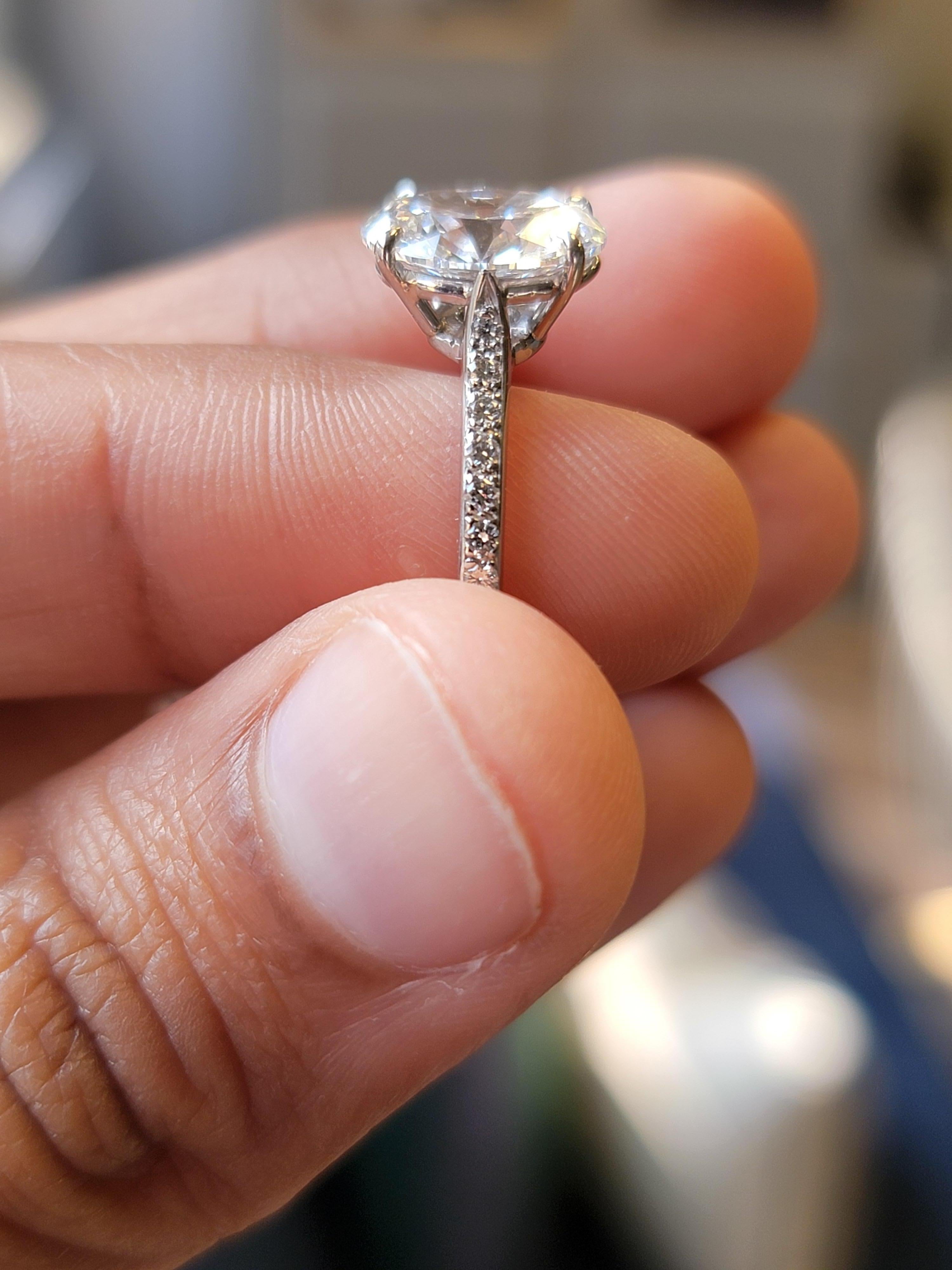 2.5 carat oval diamond ring on hand