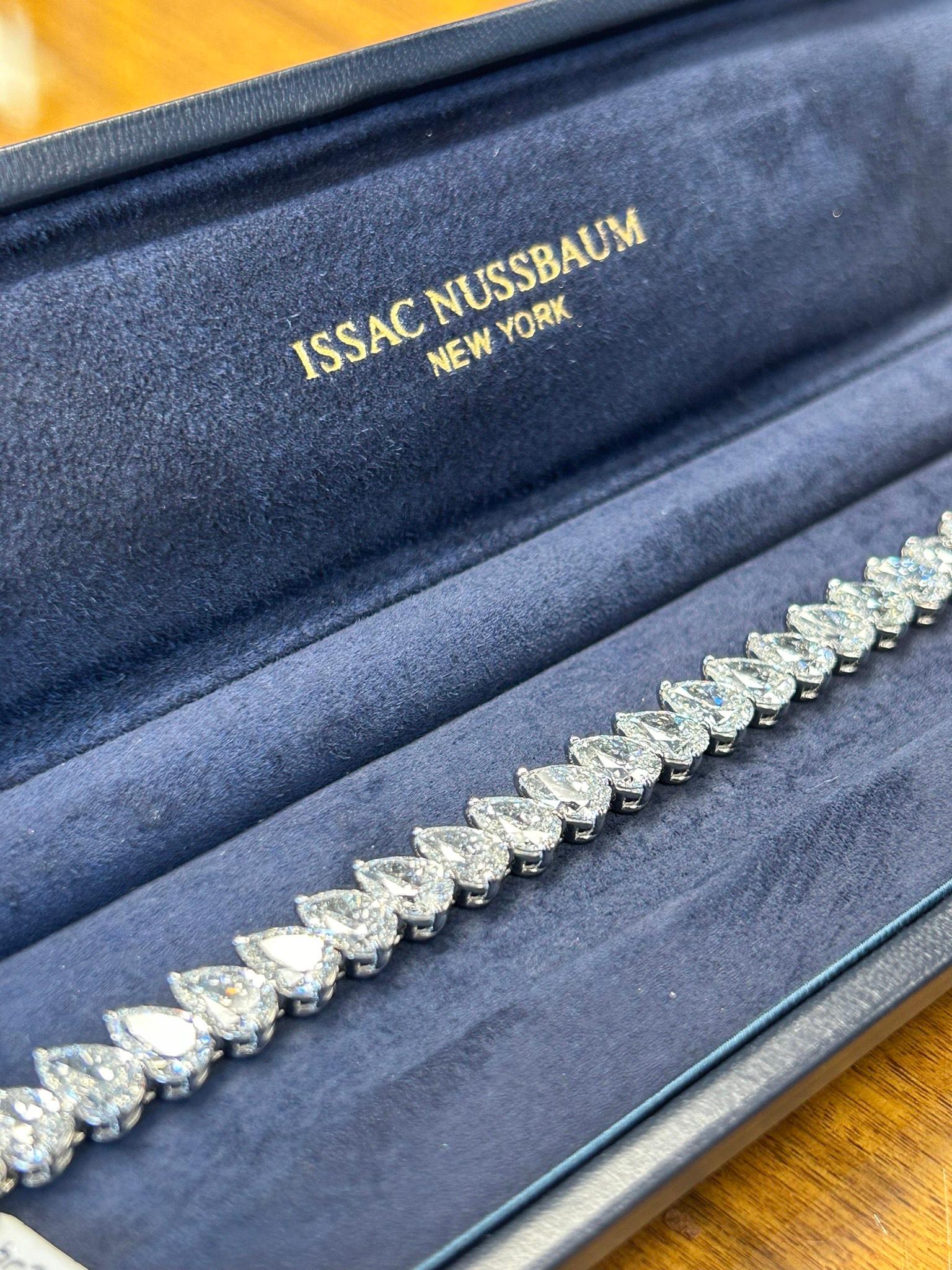 Adorning your wrist with a symphony of elegance, a dazzling testament to timeless beauty with our GIA certified Platinum 23.74 carat Diamond Pear Shape Tennis Bracelet. This exquisite natural pear-shaped diamond tennis bracelet is more than just a