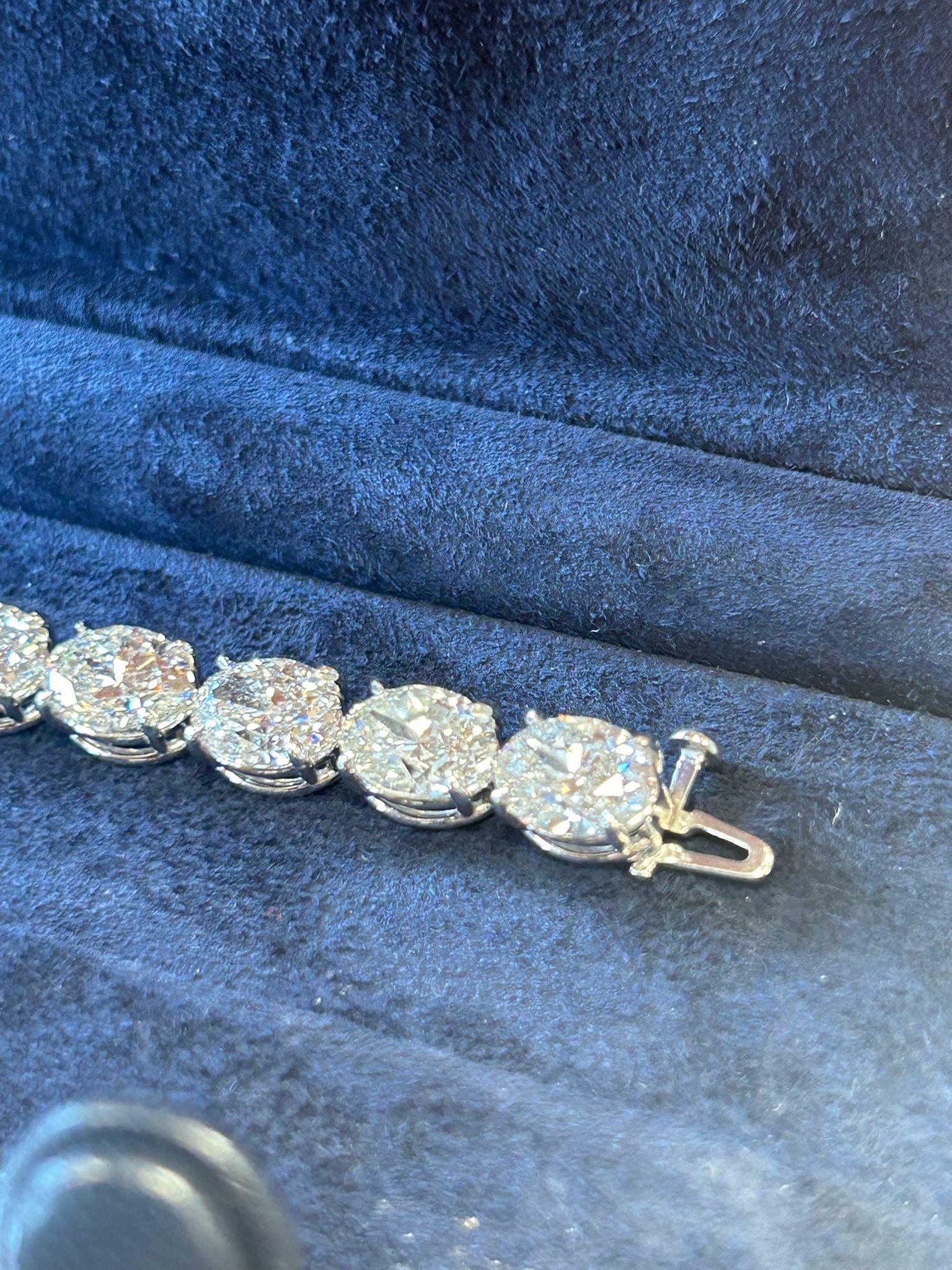 Modern Issac Nussbaum Platinum 28.62 Carat Oval Diamond Tennis Bracelet.