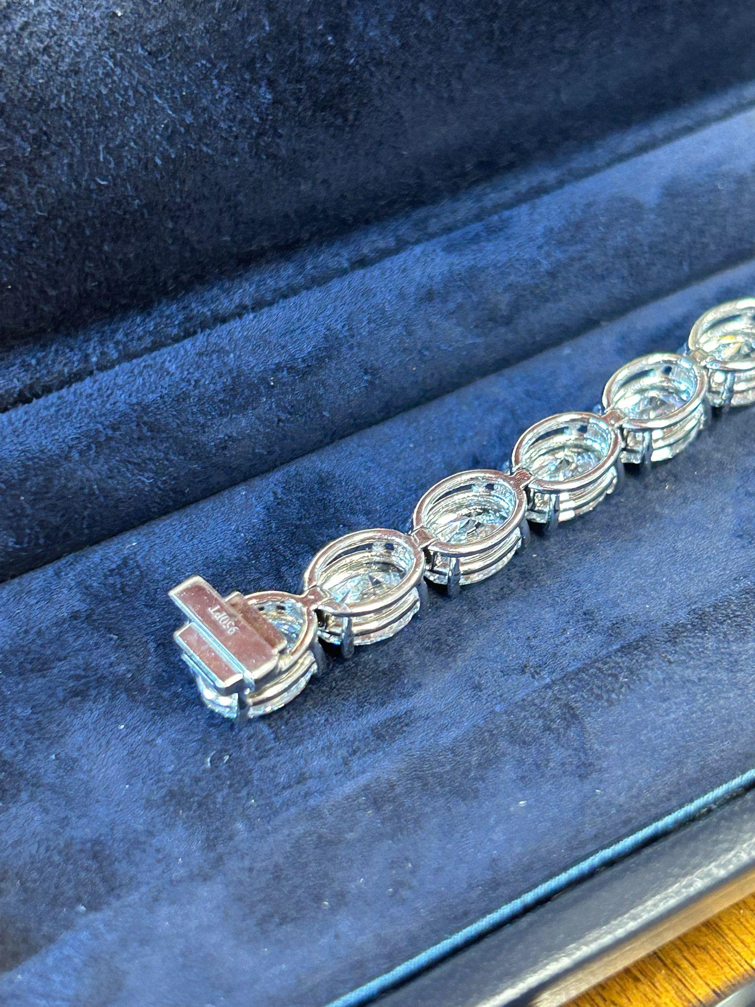 Oval Cut Issac Nussbaum Platinum 28.62 Carat Oval Diamond Tennis Bracelet.