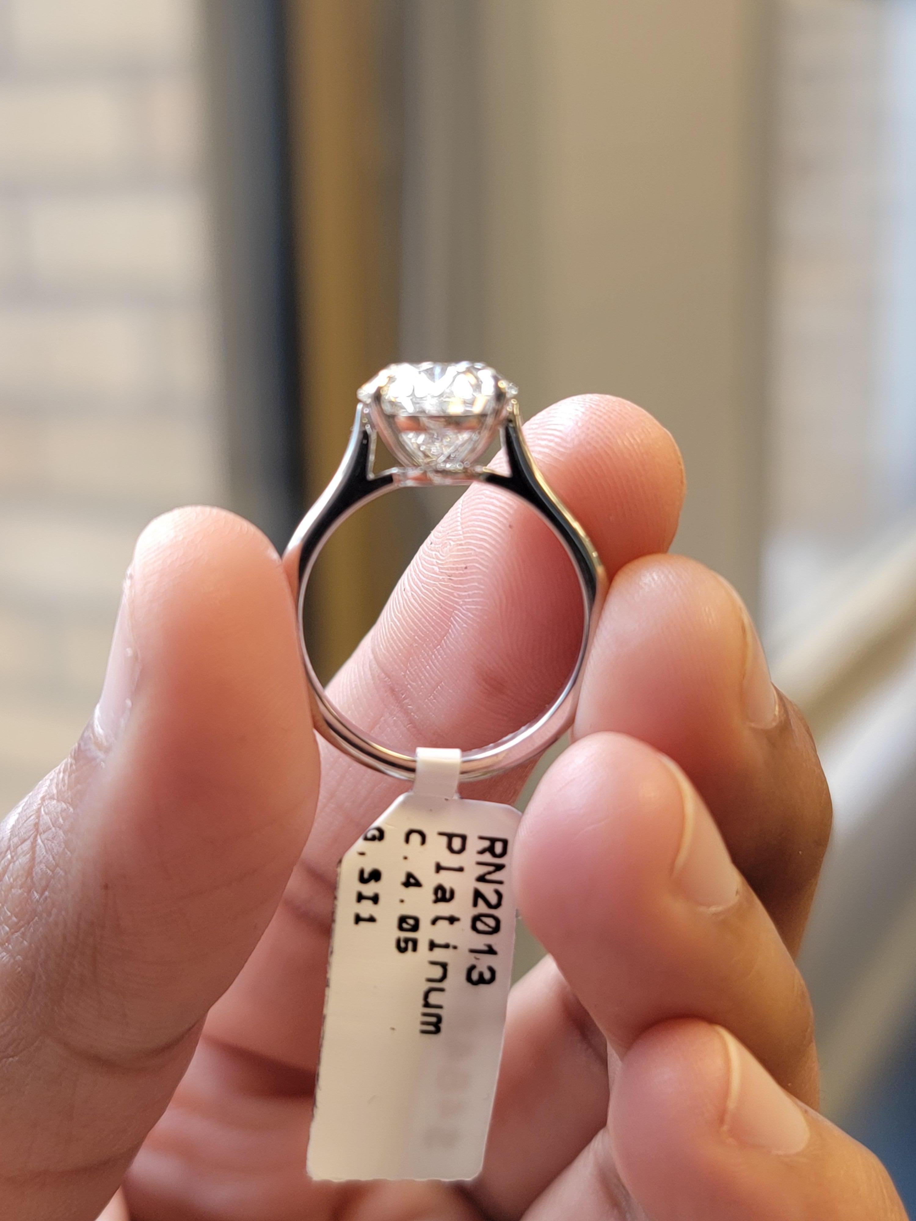 Modern Issac Nussbaum Platinum 4.05 Carat Oval Diamond Engagement Ring. For Sale