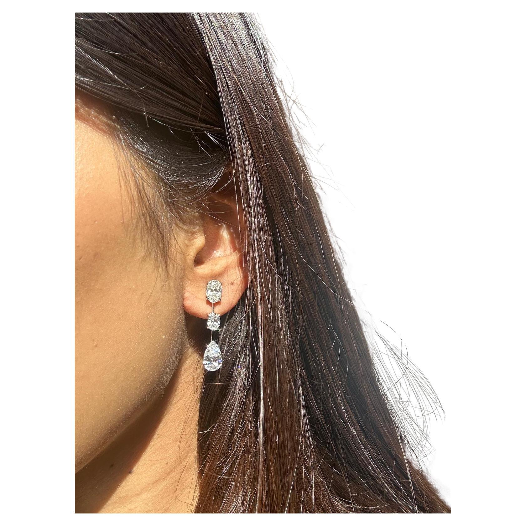 Issac Nussbaum Platinum 5.73 Carat Oval and Pear Shape Diamond Earrings.