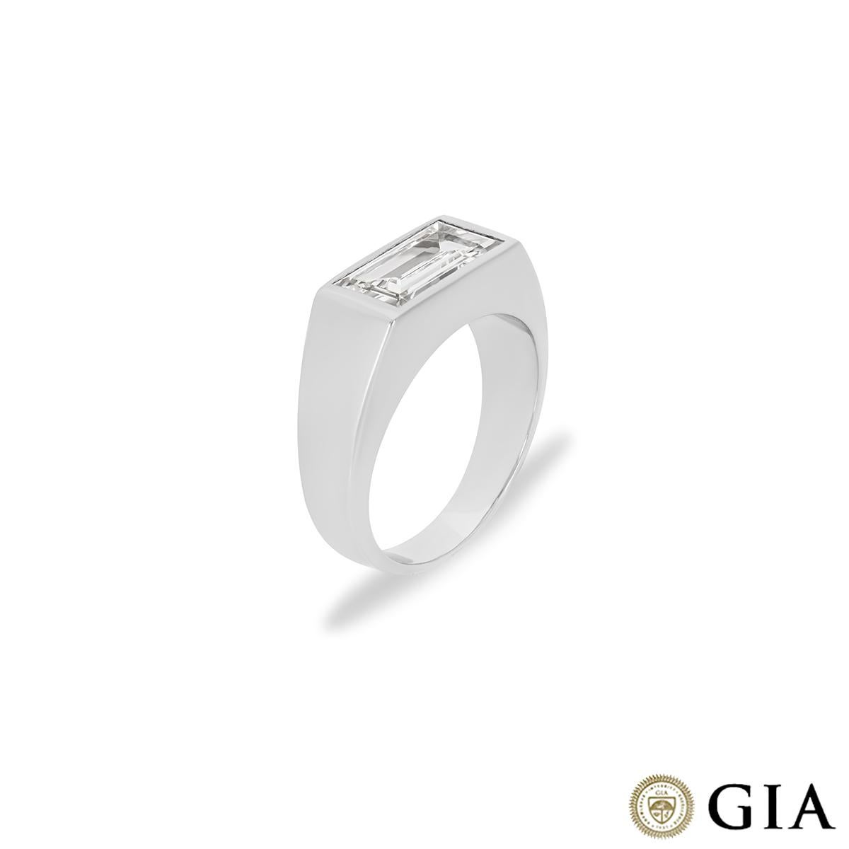 An intriguing platinum diamond dress ring. The ring is set with a baguette cut diamond bezel set in an East-West mount weighing 1.98ct, J colour and SI2 clarity. The ring tapers from 8mm to 4mm wide, has a gross weight of 17.92 grams and is