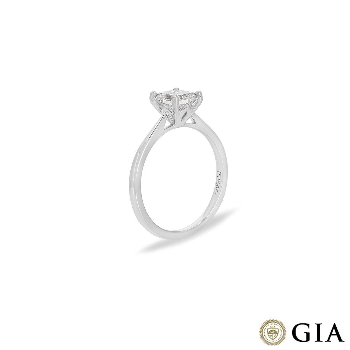 A classic platinum diamond engagement ring. The solitaire is set in a classic four prong mount with an emerald cut diamond weighing 1.03ct, E colour and VVS2 clarity. The ring tapers from 1mm to 2mm, has a gross weight of 3.54 grams and is currently
