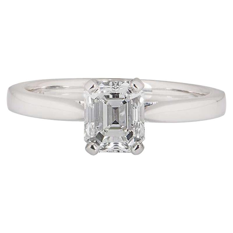 A beautiful emerald cut diamond ring in platinum. The ring comprises of an emerald cut diamond within a classic four claw setting weighing 1.18ct, E in colour and VVS1 clarity. The ring is currently a size UK M - EU 52 - US 6 but can be adjusted for