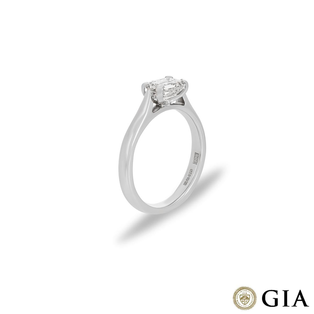 A modern platinum diamond solitaire ring. The ring showcases an emerald cut diamond set in an East-West mount weighing 0.73ct, E colour and VVS2 clarity. The solitaire measures 2.4mm in width, has a gross weight of 2.36 grams and is currently a UK
