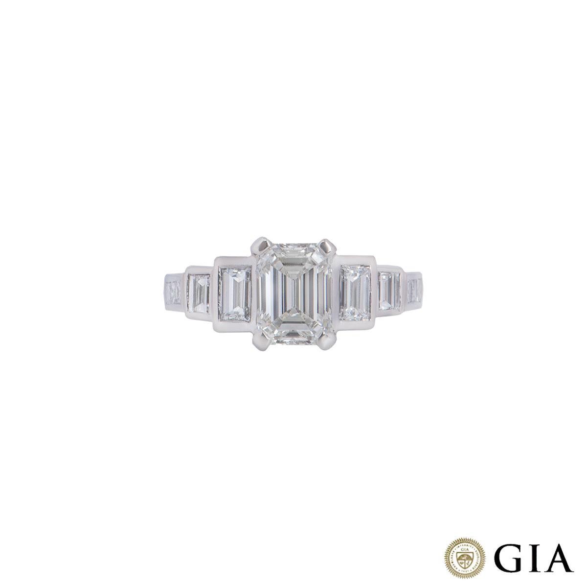 A platinum emerald cut diamond ring. The ring features an emerald cut diamond as the centre stone with 4 baguette and 6 princess cut diamonds beside on the shoulders. The emerald cut diamond has a weight of 1.52ct with J colour and VS1 clarity. The