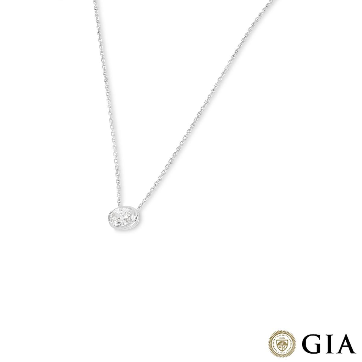 A luxurious platinum diamond pendant. Showcased in the centre of a tension mount is an oval cut diamond weighing 3.00ct, D colour and VS1 clarity. The pendant is evenly suspended from a 16-inch trace chain that finishes with a spring ring clasp and