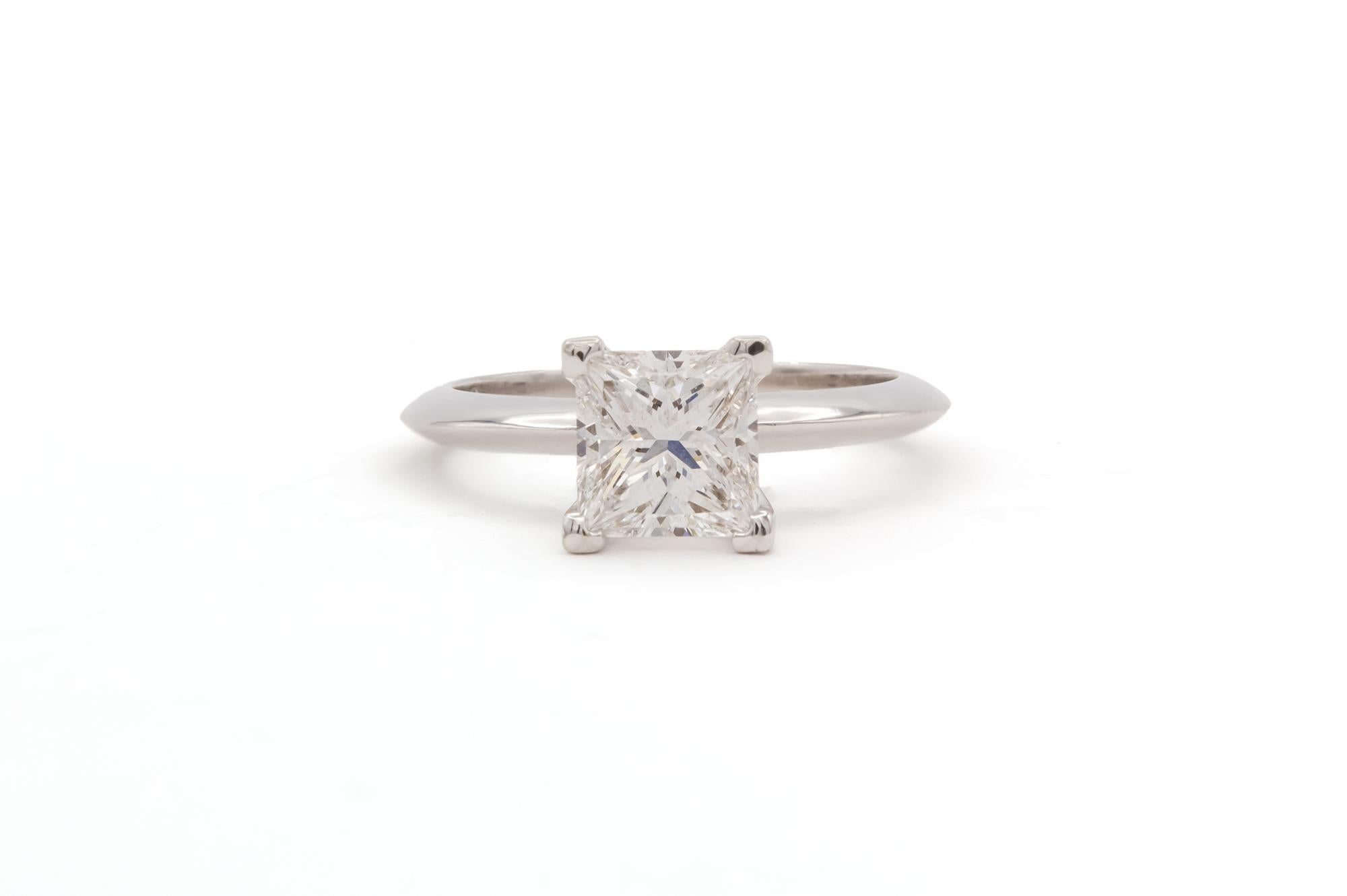 We are pleased to offer this GIA Certified Platinum & Princess Cut Diamond Solitaire Engagement Ring. This beautiful ring features a GIA certified & laser inscribed 1.65ct D/VS2 princess cut diamond set in a classic platinum 4 prong knife edge