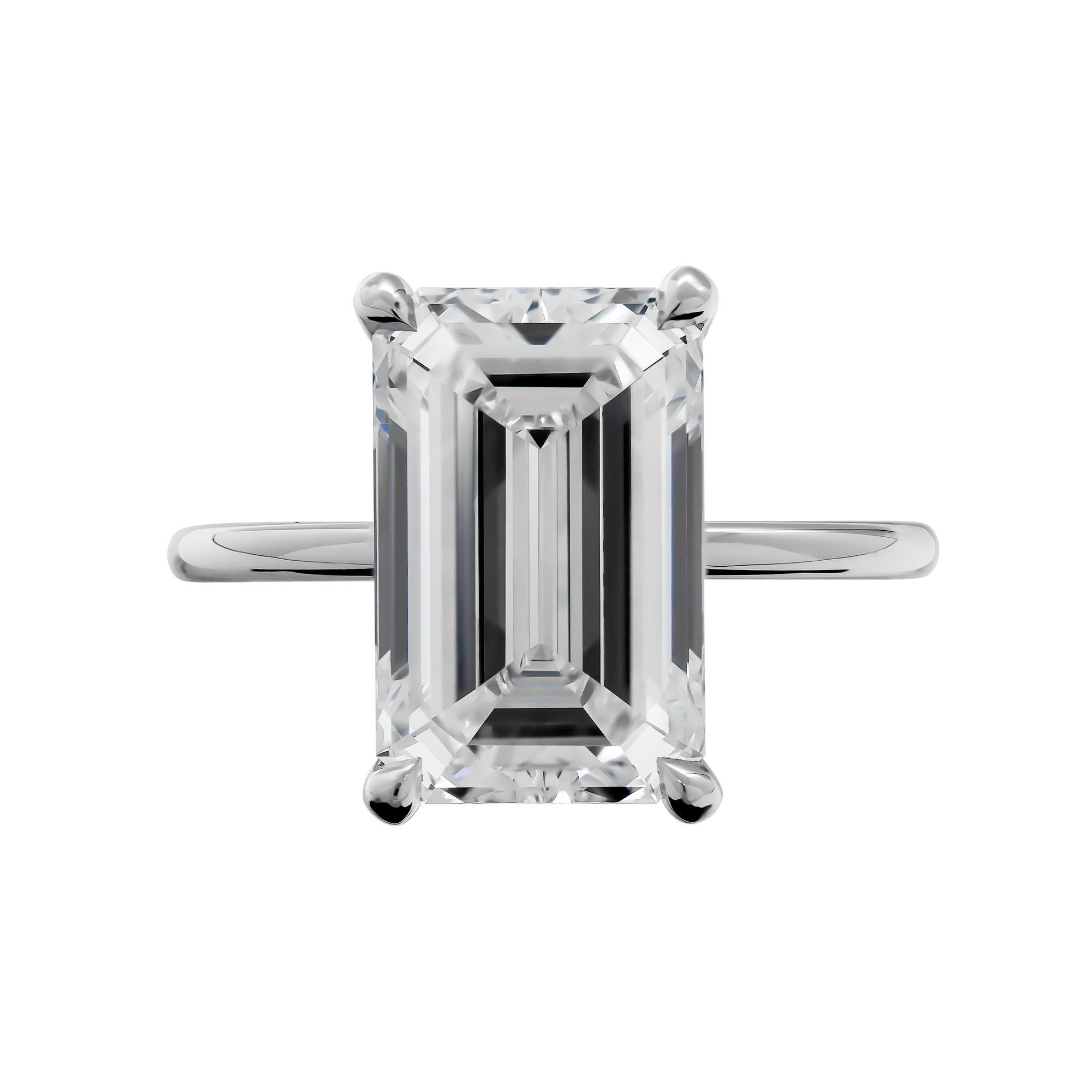 Engagement ring in Platinum 
Solitaire design made with a plain comfort fit Platinum band & 4 prongs; 
shown here with an emerald cut diamond center. 
Handmade engagement ring 
Size: 6 
Center stone: 4.00 I VS1 GIA#5222334254 Emerald Cut
Retail