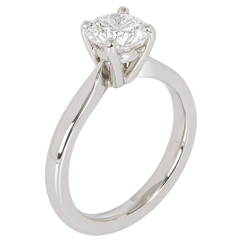 A beautiful platinum diamond solitaire ring. The solitaire is set to the centre in a four claw mount with a round brilliant cut diamond weighing 1.13ct, E colour and VS1 clarity. The ring measures 2.43mm wide, has a gross weight of 6.19 grams and is