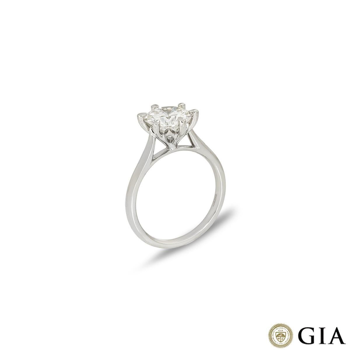 A dazzling platinum diamond engagement ring. The solitaire features a round brilliant cut diamond set in a contemporary six prong mount weighting 2.06ct, I colour and VS1 clarity. The 2mm wide ring has a gross weight of 5.30 grams and is currently a