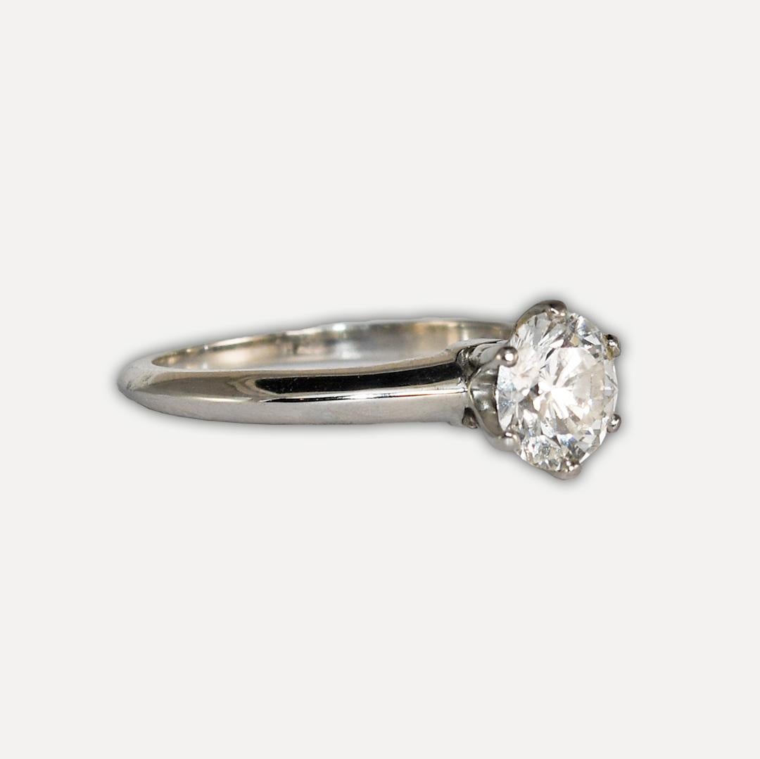 Ladies Tiffany & Co diamond solitaire ring with platinum settings.
The inside of the ring is stamped Tiffany & Co Pt 950, 1.03, D24101.
The gross ring weight is 2.4 grams. 
The 1.03-carat round brilliant diamond is graded by GIA, report number