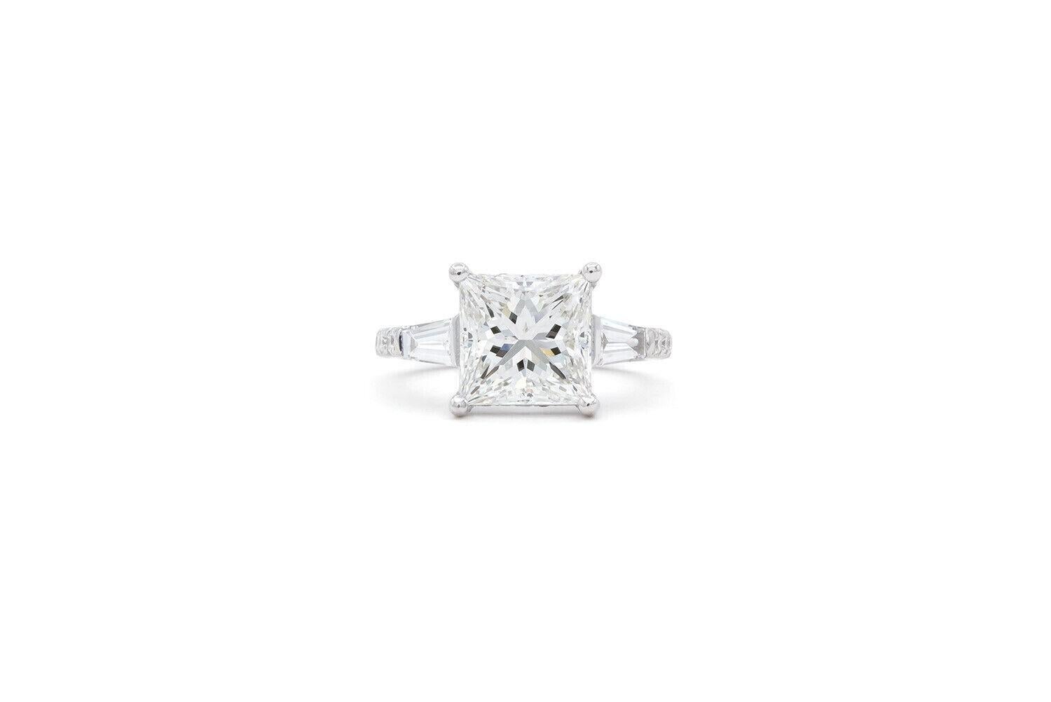 We are pleased to offer this GIA Certified Princess Cut Diamond & 14k White Gold Engagement Ring. This beautiful ring features a GIA certified & laser inscribed 3.05ct F/IF (internally flawless) princess cut diamond accented by and estimated 0.70ctw