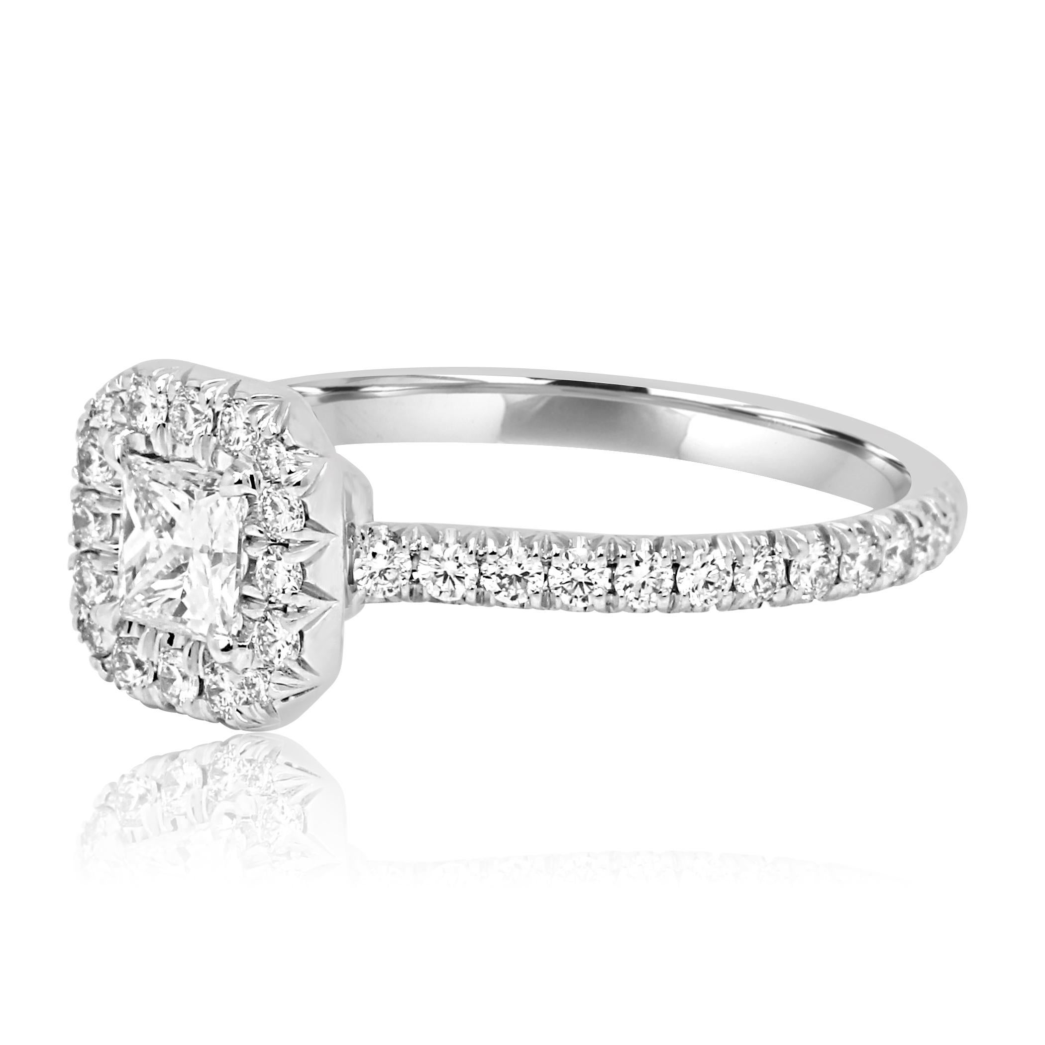 GIA Certified Princess Cut E color SI2 Clarity 0.43 Carat Encircled in a Halo of 42 White G-H color Diamond Rounds VS-SI Clarity 0.50 Carat set in 18K White Gold Classic Halo Engagement Ring.

Total Diamond Weight 0.93 Carat
Matching Band