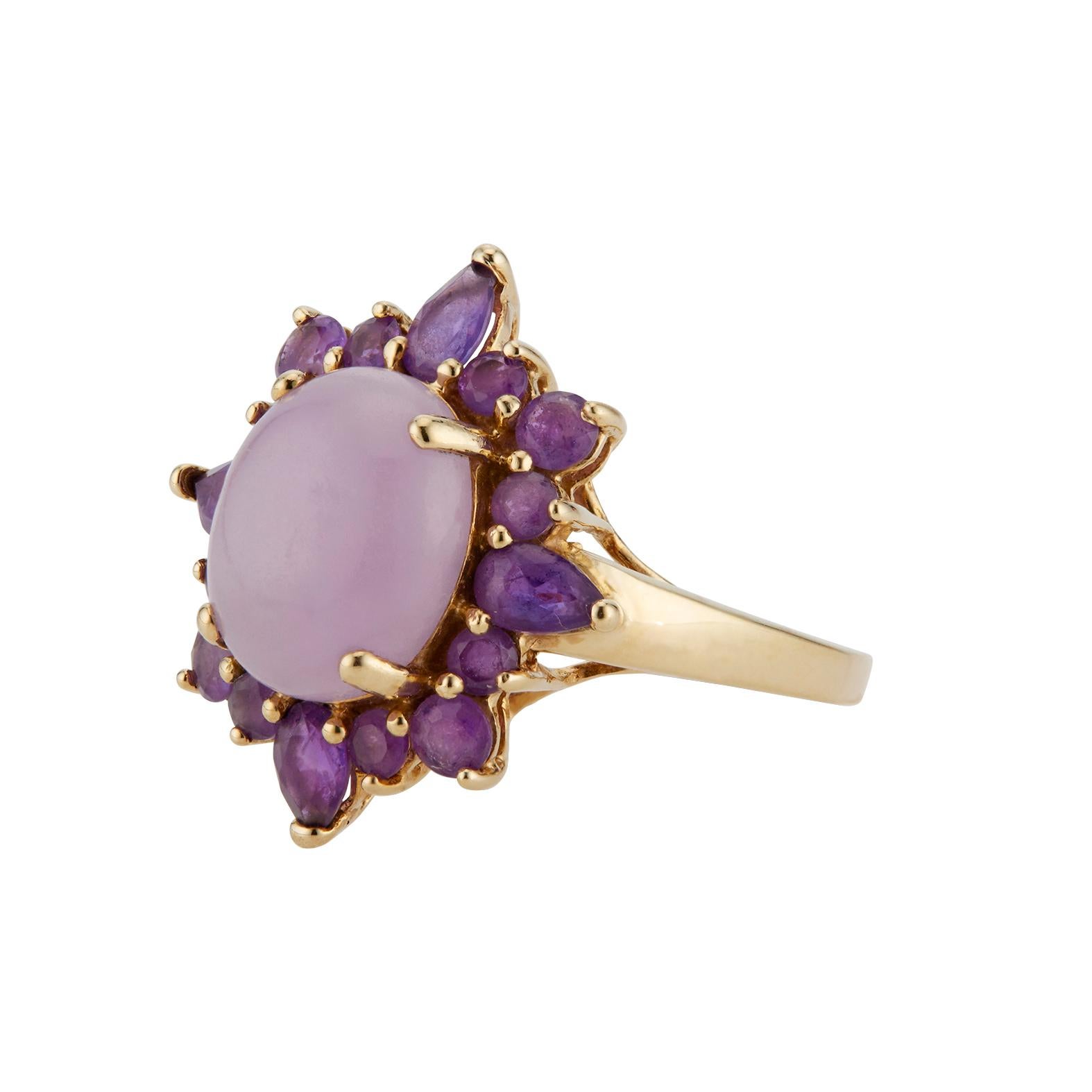 Purple Jadeite Jade garnet ring. GIA certified cabochon purple jadeite center stone with a halo of round and pear shaped garnets in a 14k yellow gold setting.  “B” grad Jadeite Jade GIA certified polymer impregnated 14k gold.

1 cabochon purple