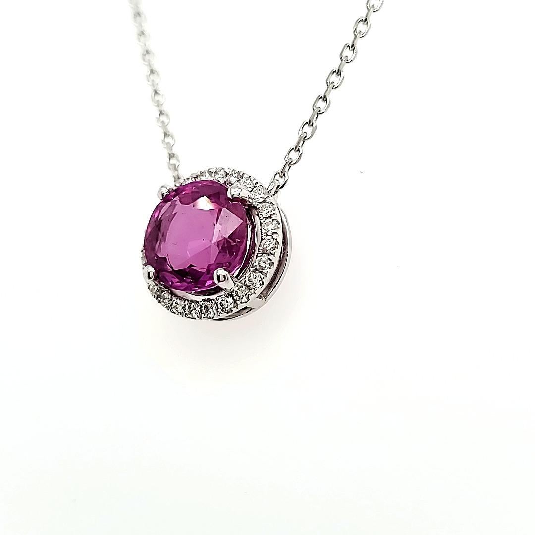 GIA certified Purplish Pink Sapphire Pendant with Diamonds 

This purplish pink Sapphire has a tone of its own. Exquisite and playful yet serious. Not all purplish pink Sapphires hit the right tone of color, but this one has. 

Probably crystallized