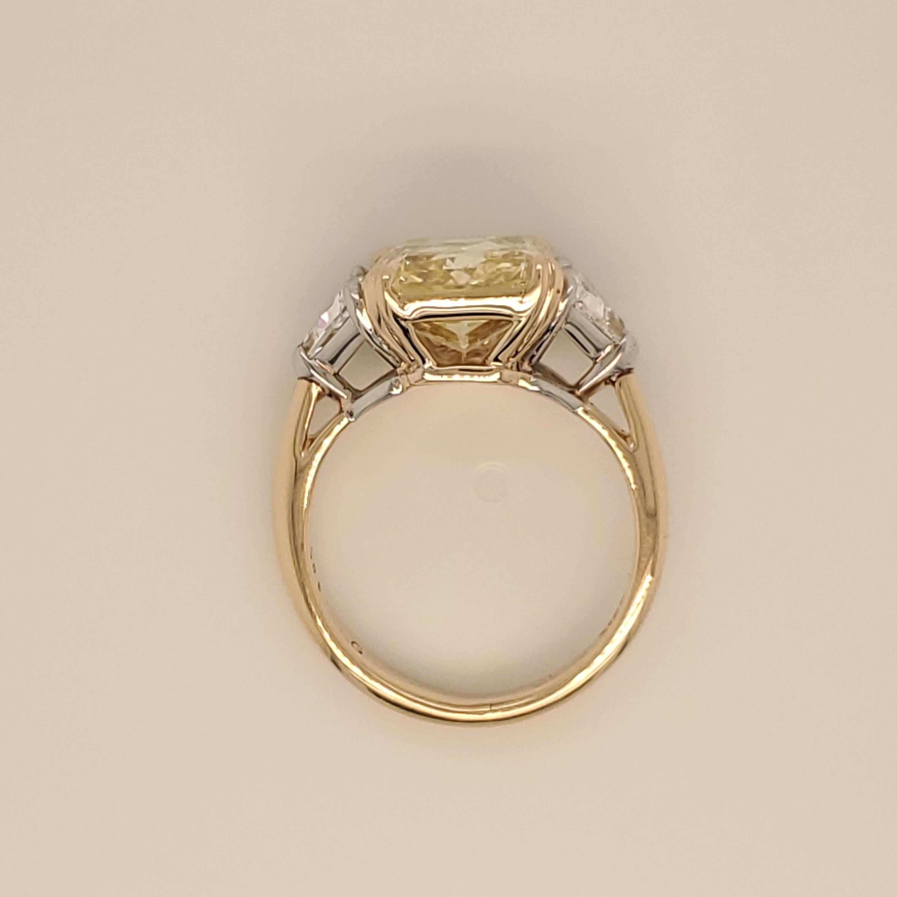 GIA Certified Radiant Cut 5.01 Carat Fancy Intense Yellow Three-Stone Ring In New Condition In New York, NY