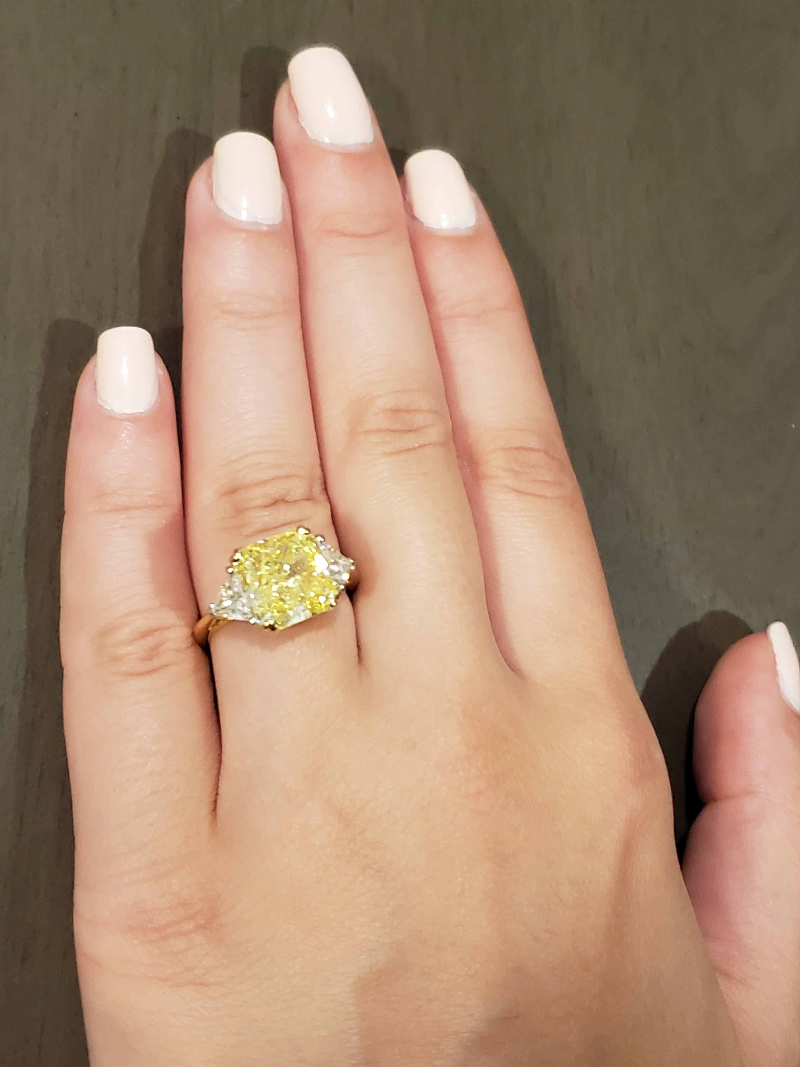 Women's GIA Certified Radiant Cut 5.01 Carat Fancy Intense Yellow Three-Stone Ring