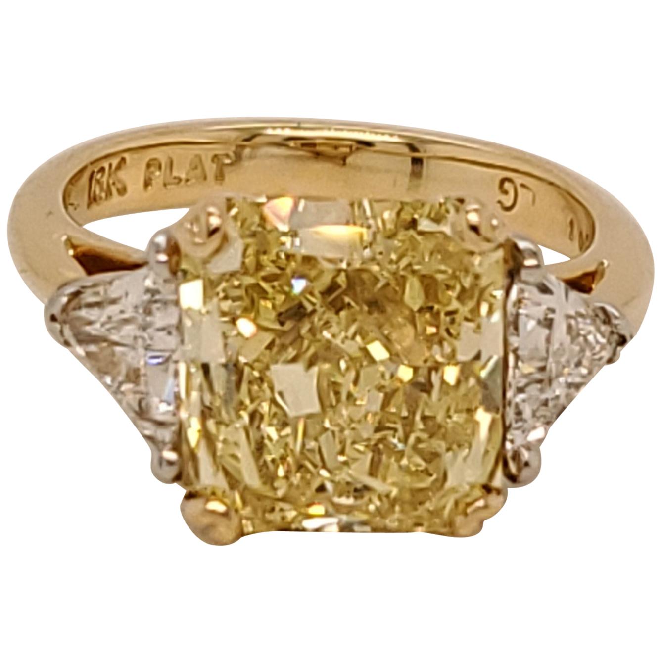 GIA Certified Radiant Cut 5.01 Carat Fancy Intense Yellow Three-Stone Ring