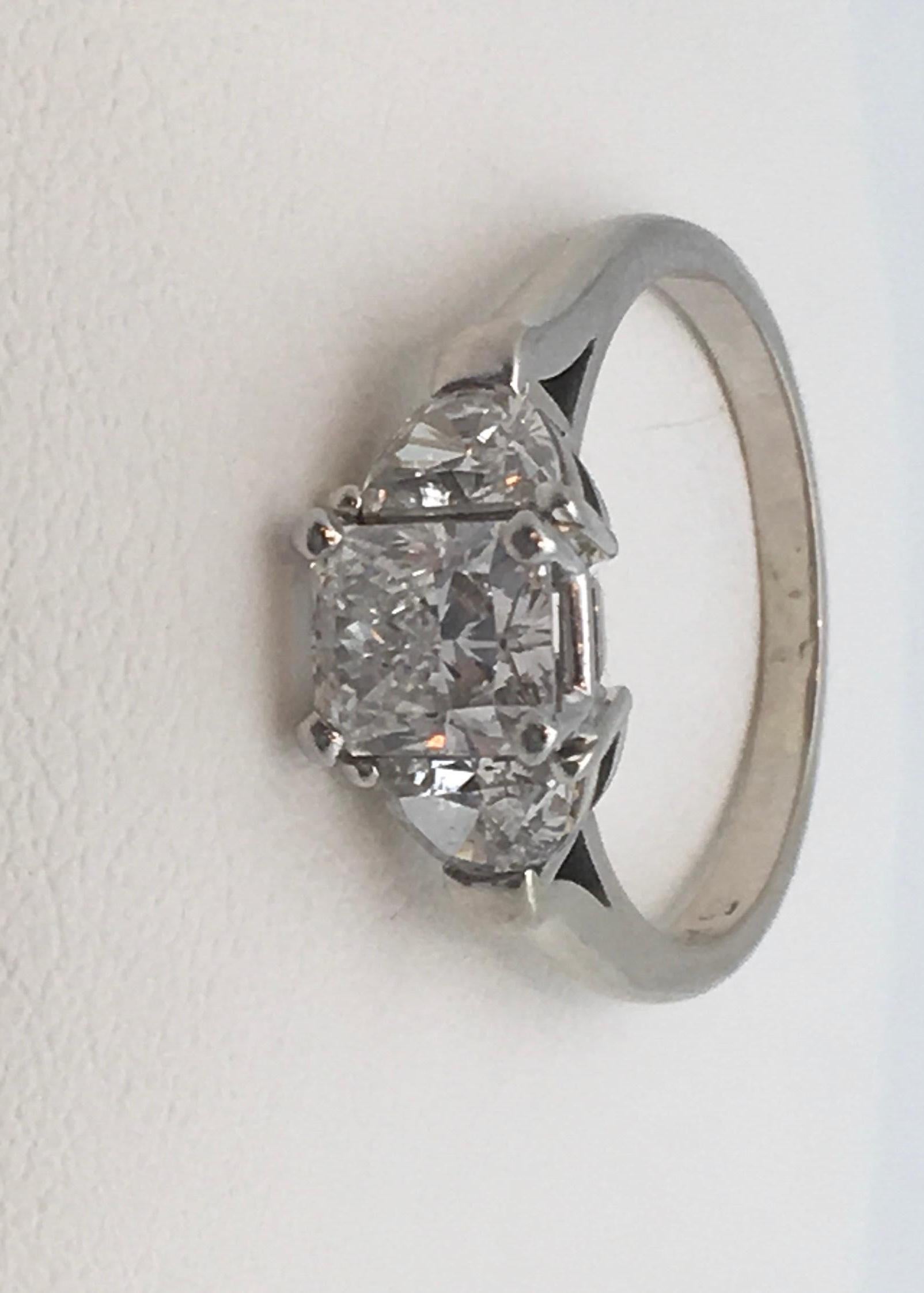 The Center Radiant Diamond Weights 1.22 Carats (scale weight).
The Clarity is G color and SI2 Clarity.
Pleas check out the GIA Certificate #2135605832. This is probably one of the best SI2’s that you will ever see.
The two Half Moon cut Side