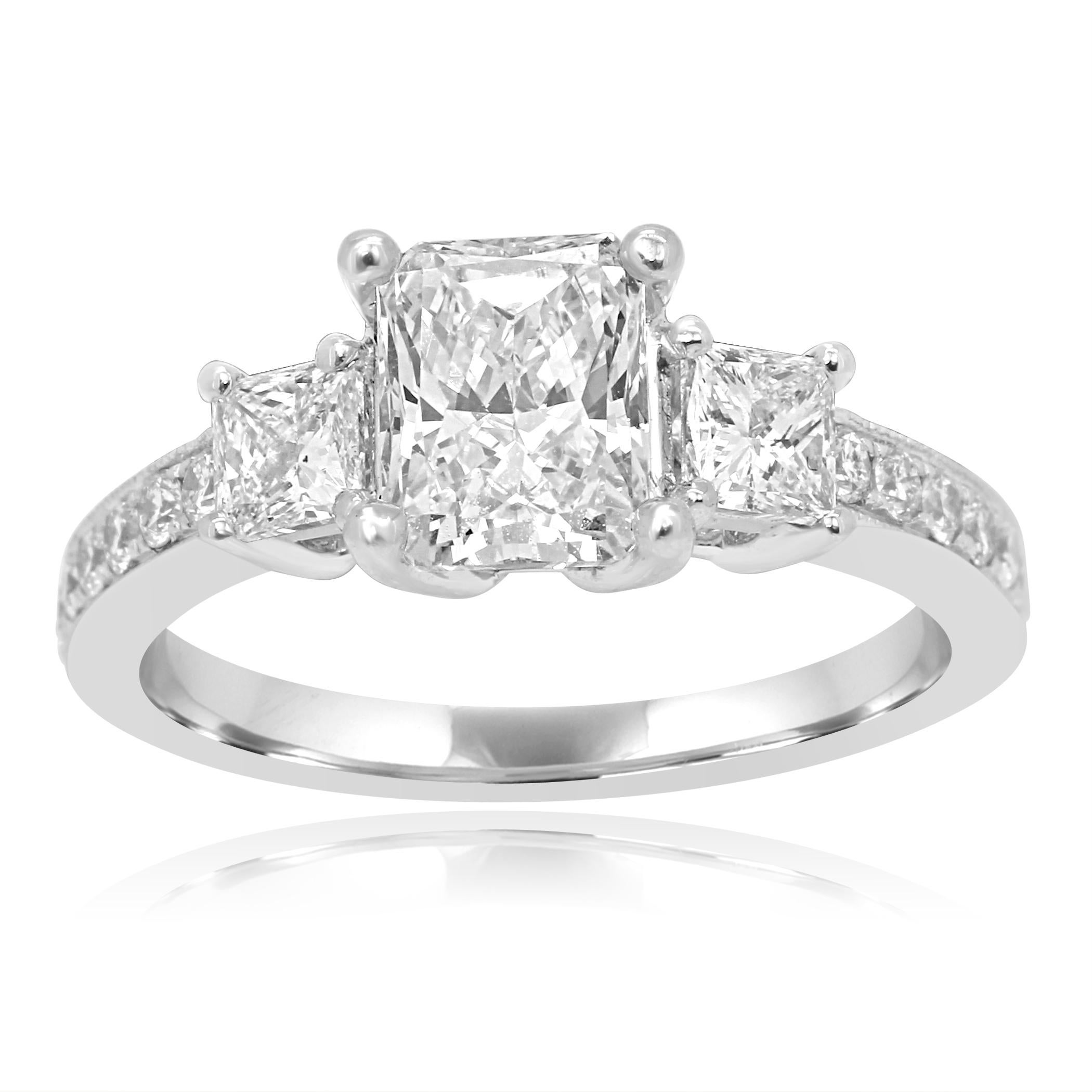 GIA Certified L VS1 Radiant Cut 1.31 Carat Flanked with 2 Colorless Diamond Princess Cut on the sides 0.52 Carat set with Colorless Round Brilliant Diamond on the Shank 0.48 Carat in 14K White Gold Bridal Engagement Three Stone Ring.

Style