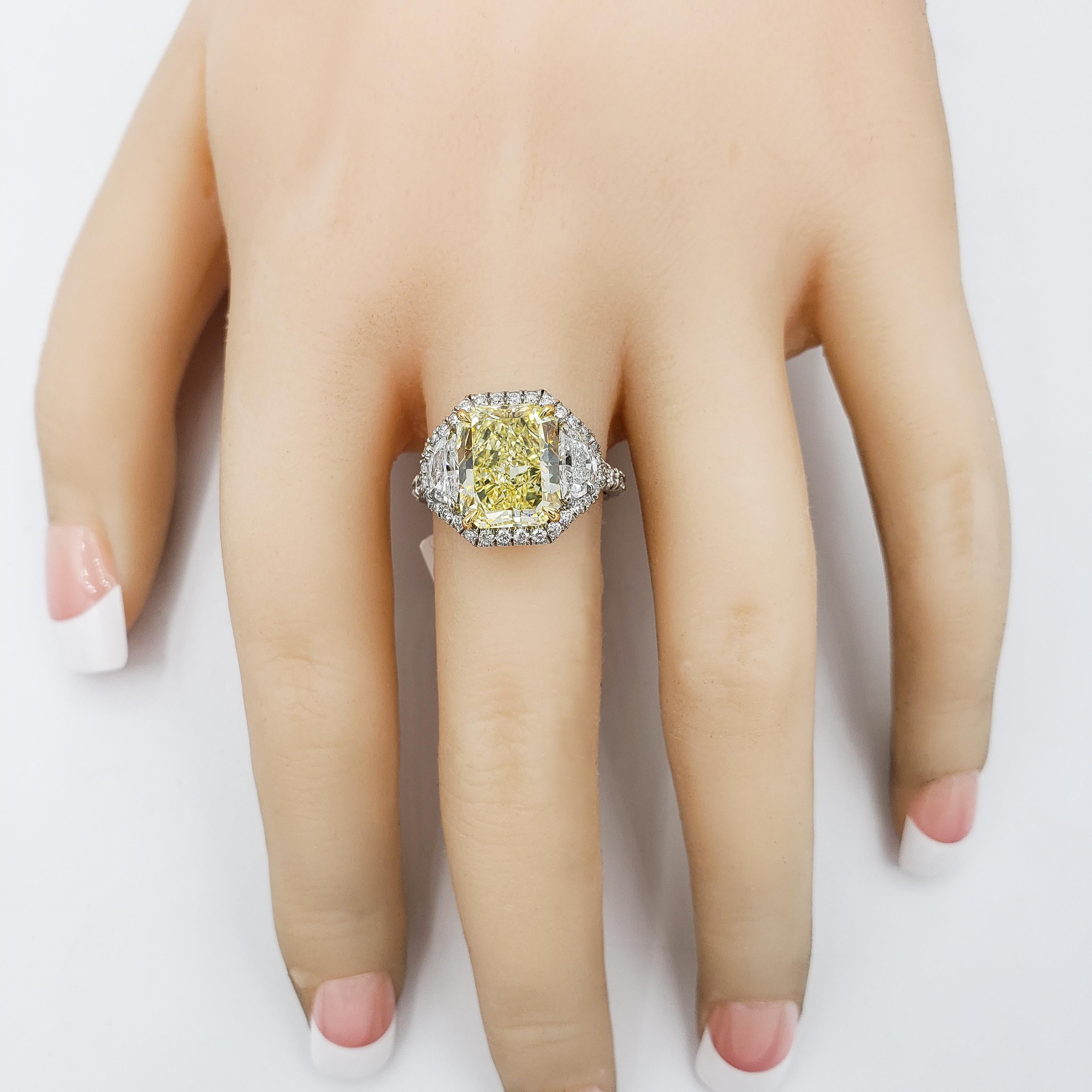 3.64 Carats Total Radiant Cut Yellow Diamond Halo Three-Stone Engagement Ring In New Condition For Sale In New York, NY