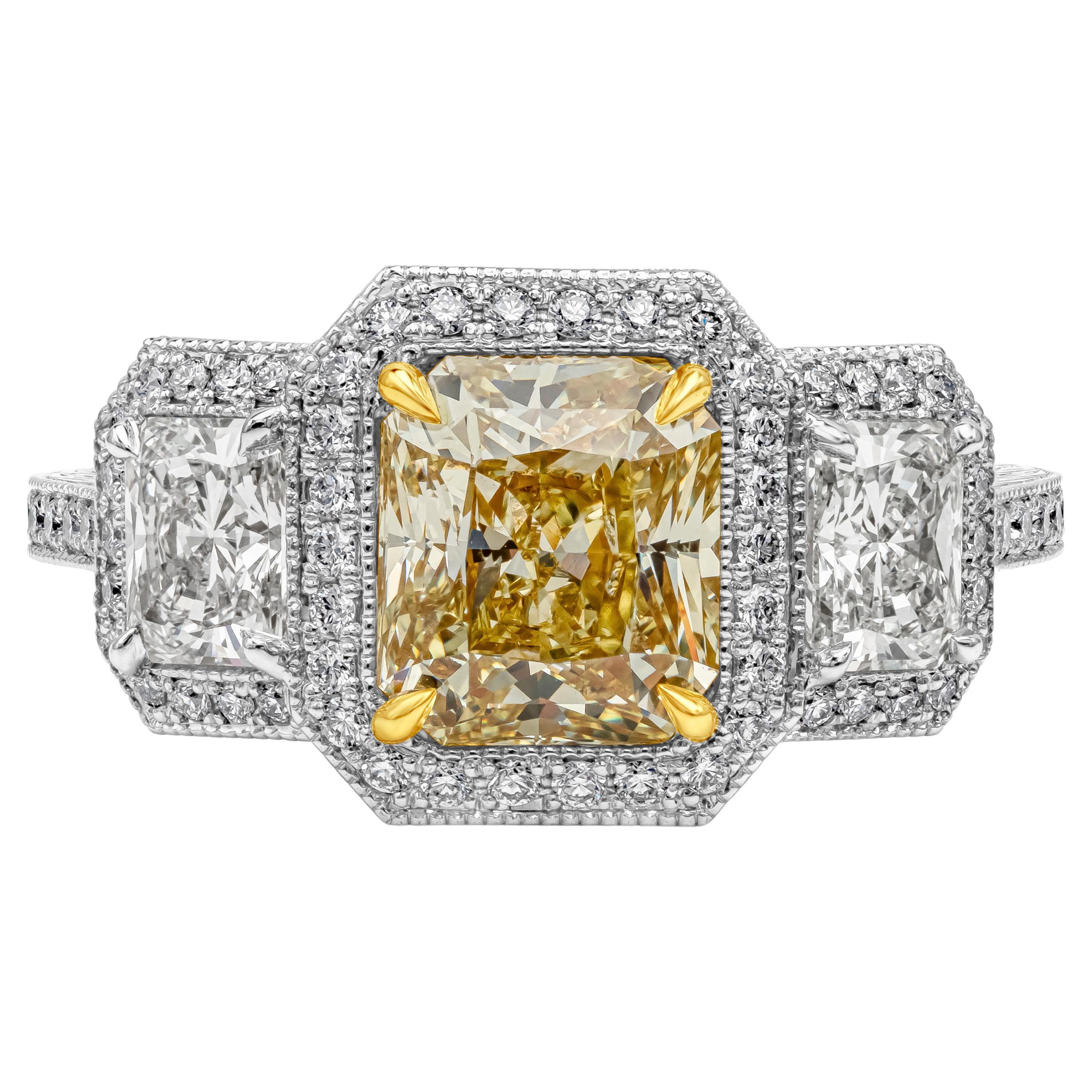 1.96 Carats Radiant Cut Fancy Yellow Diamond Three-Stone Halo Engagement Ring For Sale