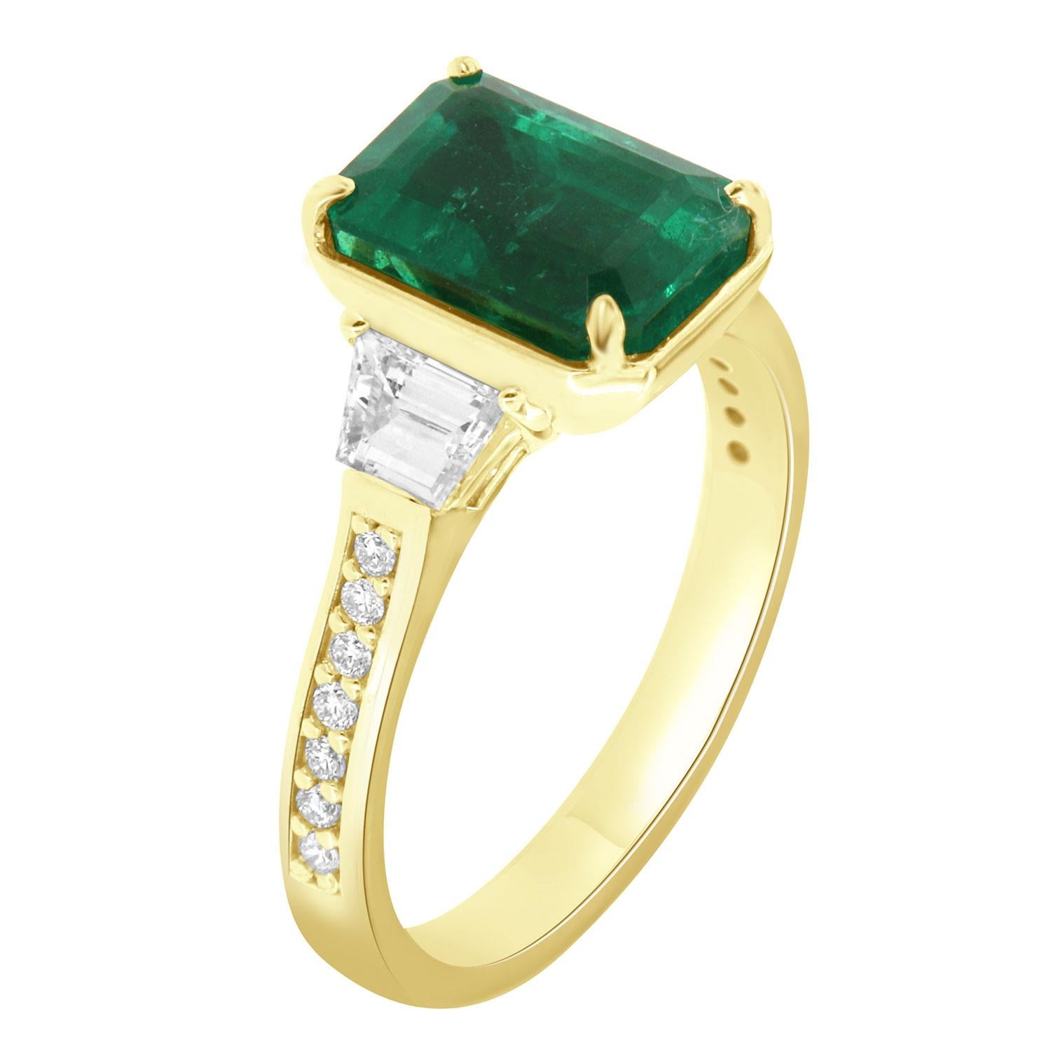 This stunning ring features a Rare Not Enhanced by oil or any other substance GIA Certified 3.26 Carat Vibrant Green Emerald flanked by two Trapez shaped diamonds in a total weight of 0.58 carat accented by seven (7) diamonds set on each side for a