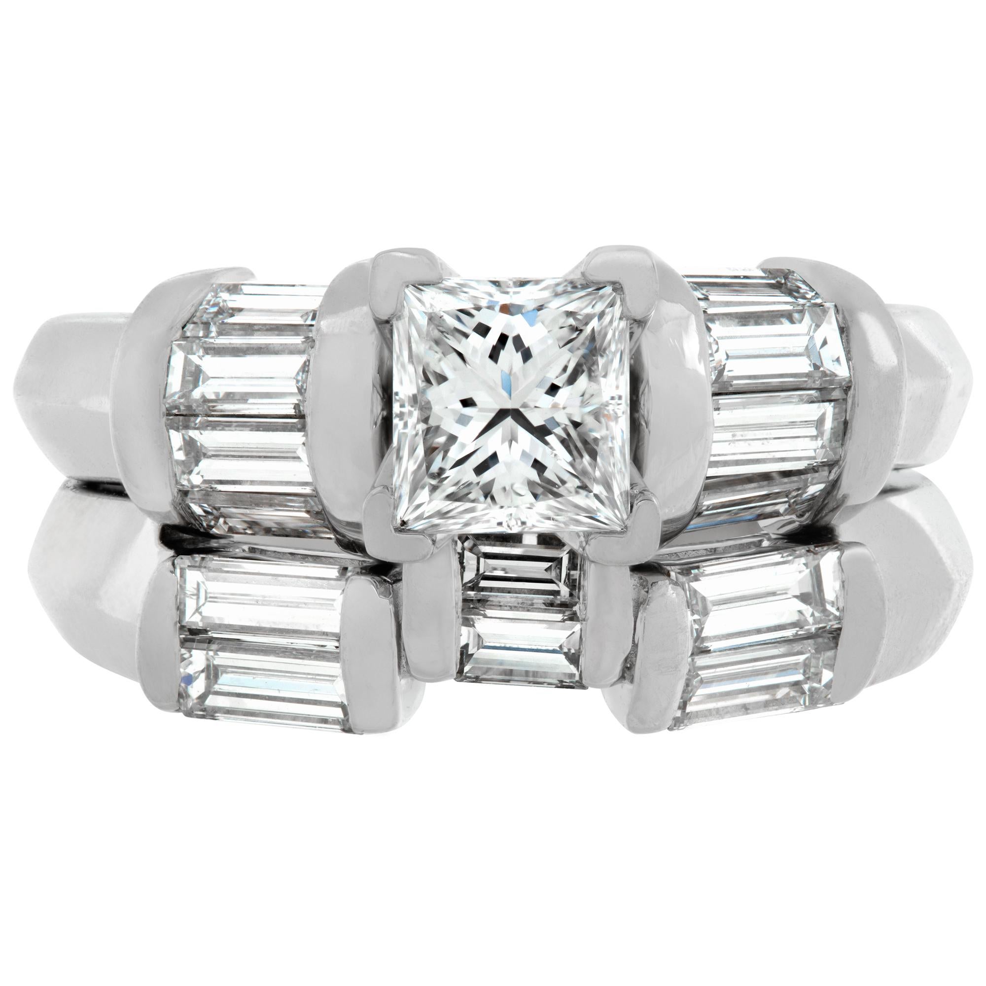 GIA certified rectangular modified brilliant cut diamond: 0.74 carat, E color- SI1 clarity, set in engagement ring with matching wedding band in platinum. Baguette diamonds total approx. weight: 1.00 carat, estimate: G-H color, VS-SI clarity. Size