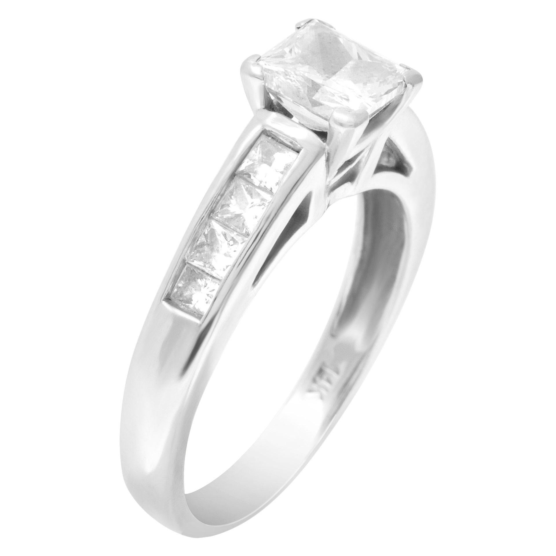 GIA certified rectangular modified brilliant cut diamond 1.01 carat (F color, SI1 clarity) ring set in 14k white gold with approx. 0.60 carat of side princess cut diamonds. Size 6.5.This GIA certified ring is currently size 6.5 and some items can be