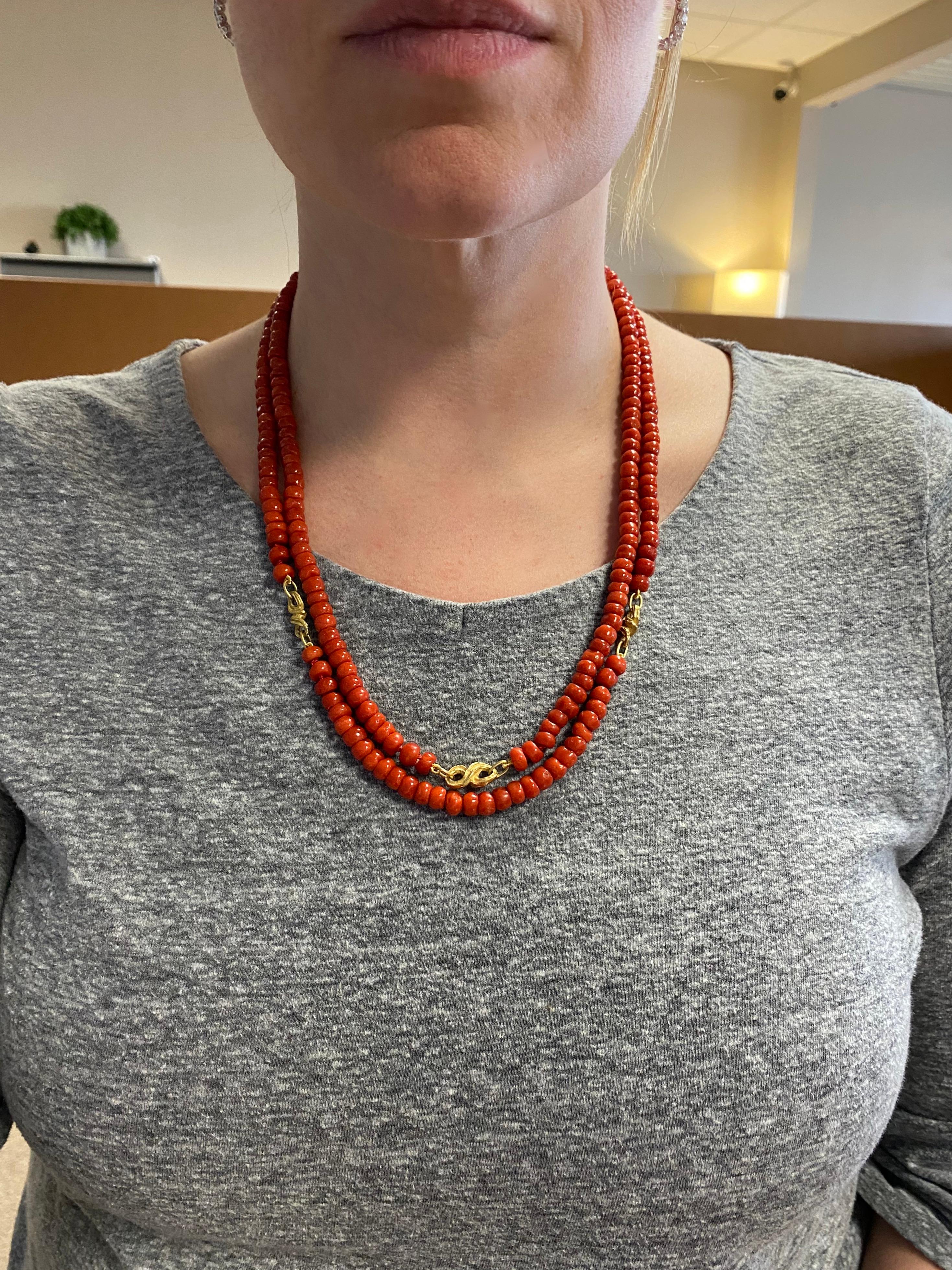 Stunning GIA certified Red Coral double strand necklace with 18k yellow gold accents. 

Certification: GIA - 2223748913
Metal: 18K Yellow Gold
Stamped: 