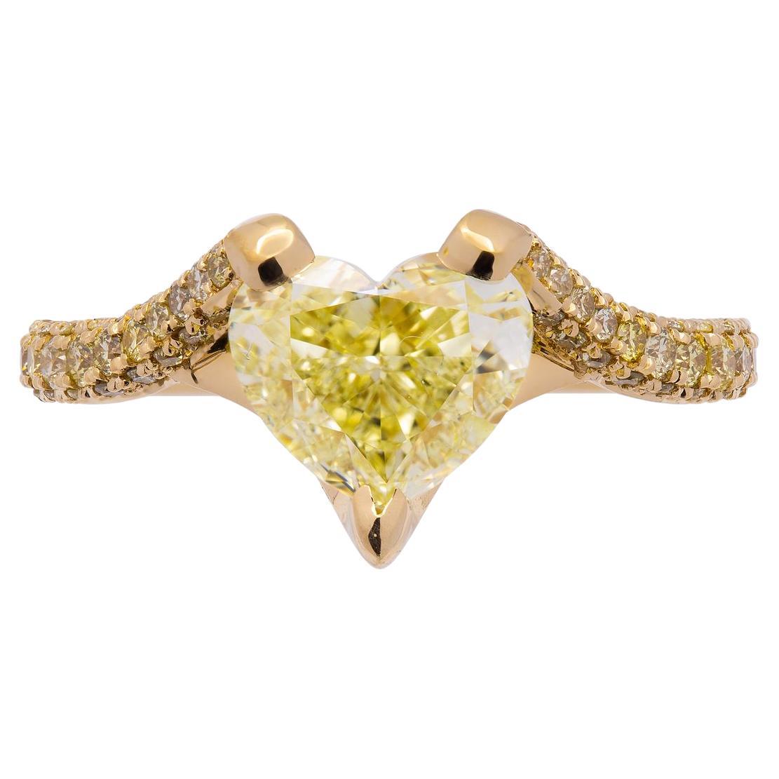 Engagement ring in 18K Yellow Gold
Center: 3.01ct Fancy Yellow SI1 Heart Shape Diamond GIA#6421252302 Fancy Yellow Diamond 
3 ROW shank; diamond prongs; diamond bridge 
TCW pave yellow: 0.83ct
 Size: 6
