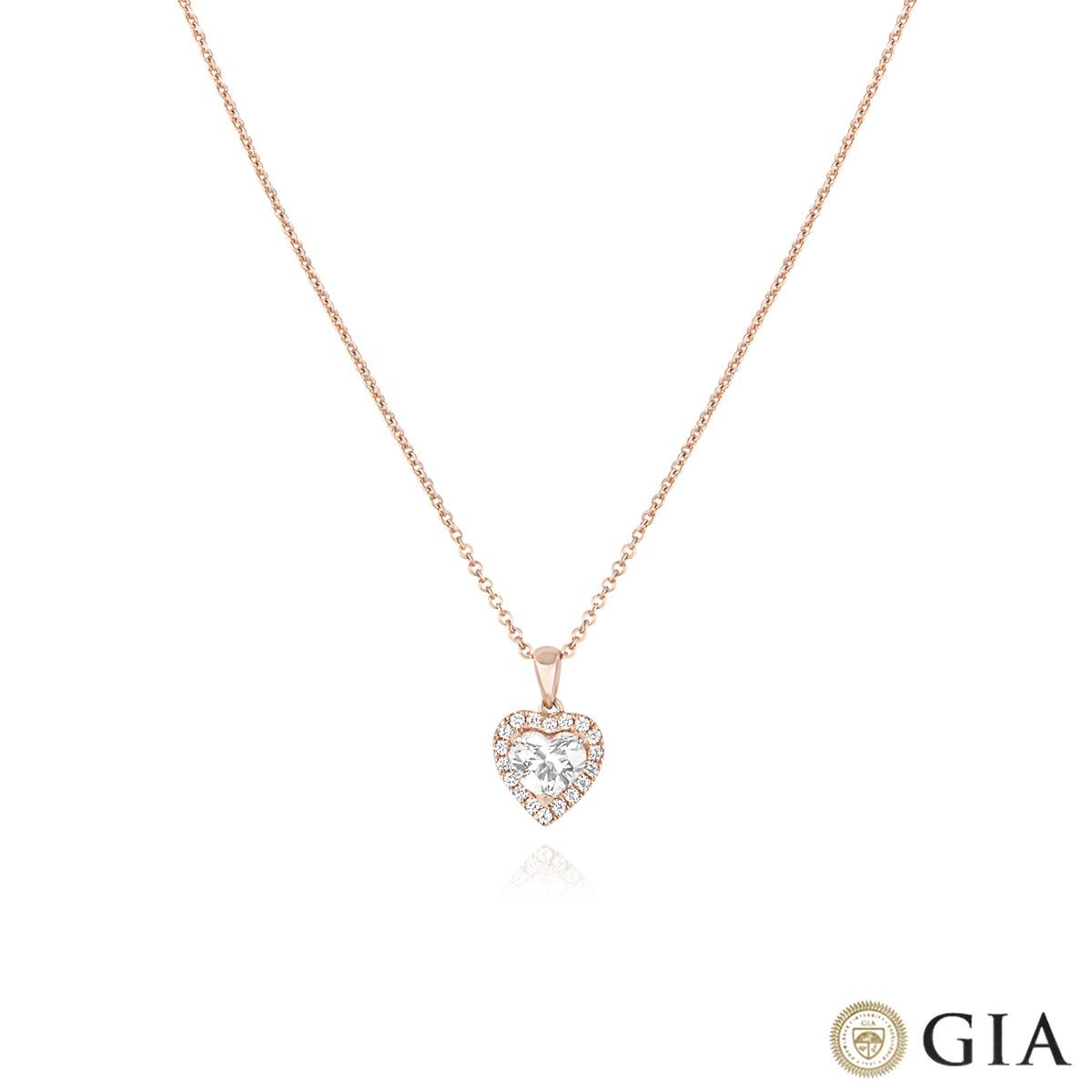 A beautiful 18k rose gold heart shaped diamond halo pendant. The pendant features a heart shaped diamond set to the centre weighing 0.91ct, G colour and SI1 clarity. The pendant is further complemented by 18 round brilliant cut diamonds in a halo