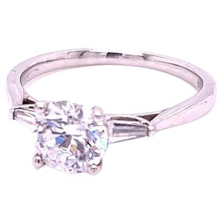 For Sale:  GIA Certified Round Brilliant and Baguette Diamond Three-Stone Ring in Platinum 2