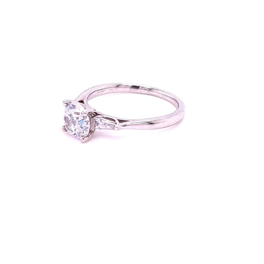 For Sale:  GIA Certified Round Brilliant and Baguette Diamond Three-Stone Ring in Platinum 4