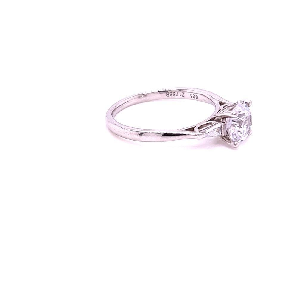 For Sale:  GIA Certified Round Brilliant and Baguette Diamond Three-Stone Ring in Platinum 5