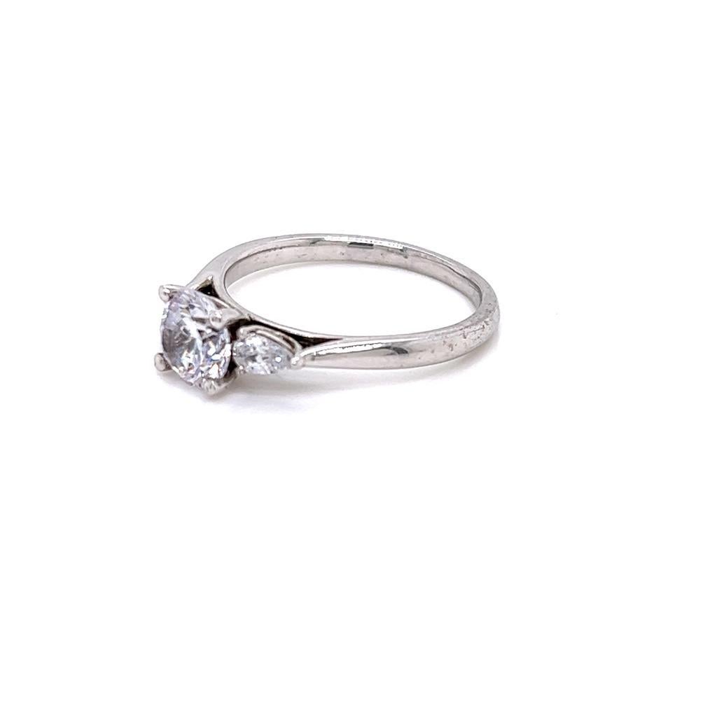 For Sale:  GIA Certified Round Brilliant and Pear Diamond Three-Stone Ring in Platinum 5