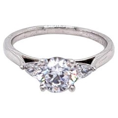 GIA Certified Round Brilliant and Pear Diamond Three-Stone Ring in Platinum