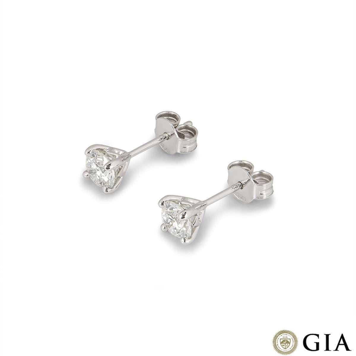 A pair of 18k white gold diamond stud earrings. The earrings feature round brilliant cut diamonds in a 4 claw setting. Both diamonds weigh 0.59ct each, H colour and VS1/VS2 clarity. Both diamonds score an excellent rating in all three aspects for