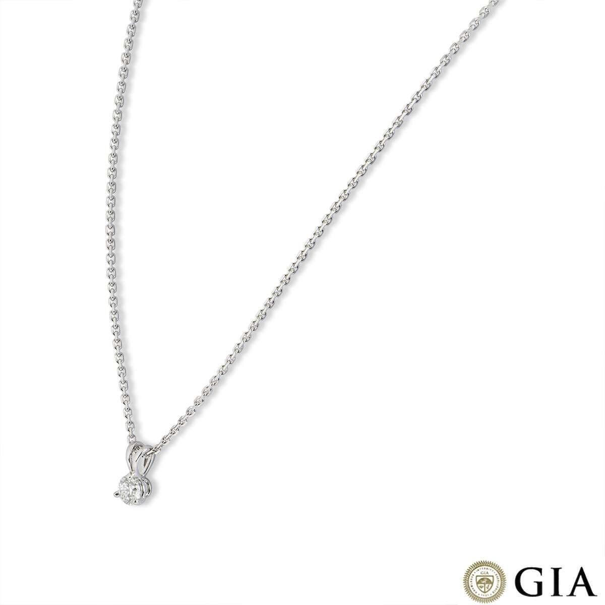 An 18k white gold diamond pendant. The pendant is set with a single round brilliant cut diamond weighing 0.52ct, H colour and VS1 clarity. The diamond scores an excellent rating in all three aspects for cut, polish and symmetry - this is known as a