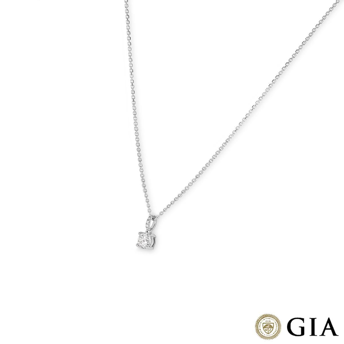 A stunning 18k white gold diamond pendant. The pendant features a round brilliant cut diamond set in a four prong mount weighing 0.70ct, I colour and VS2 clarity. Further accentuating the centre diamond are 5 round brilliant cut diamonds pave set to