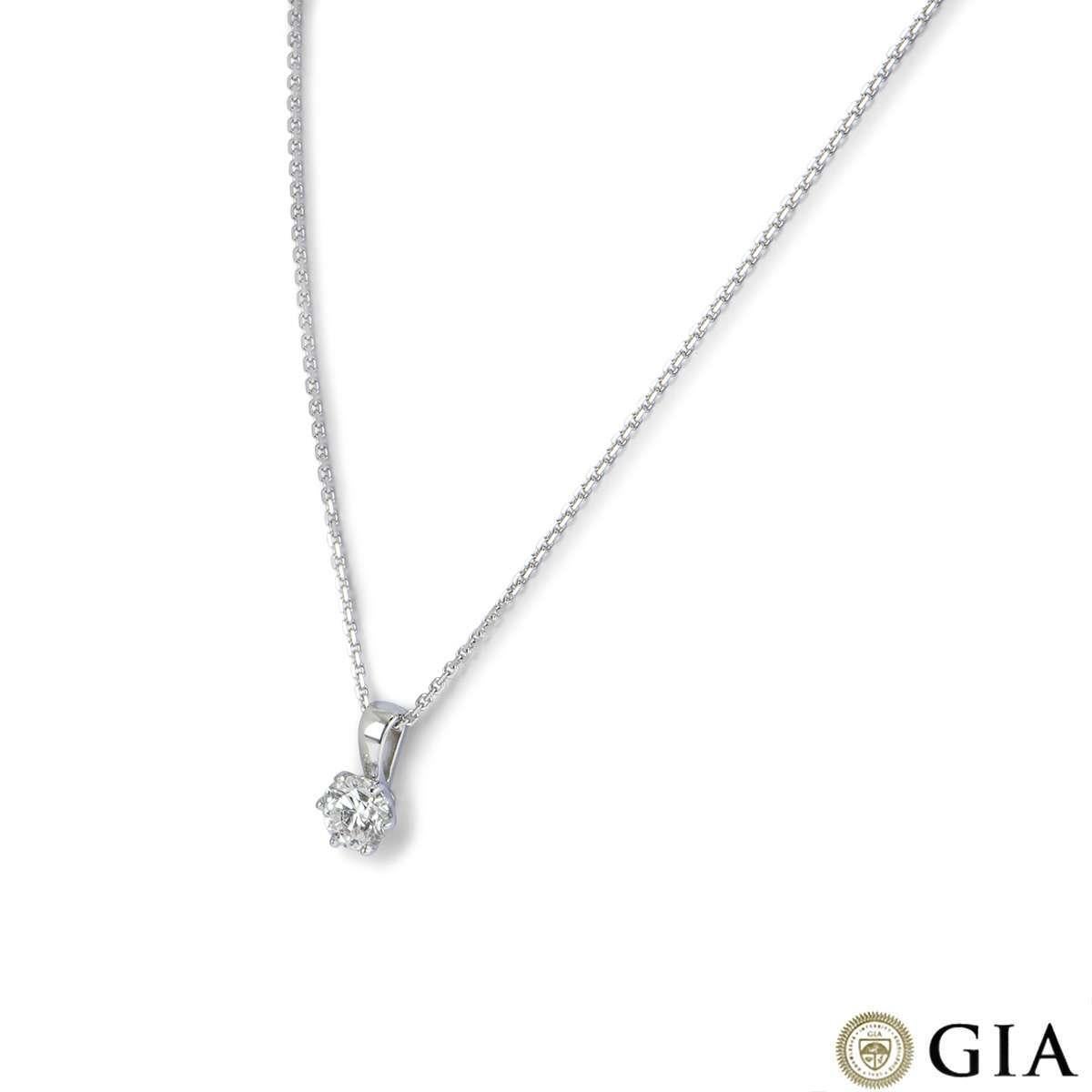 An 18k white gold diamond pendant. The pendant is set with a single round brilliant cut diamond weighing 0.90ct, G colour and VS1 clarity. The pendant comes on an 18 inch trace chain, complete with a lobster clasp. The necklace has a gross weight of