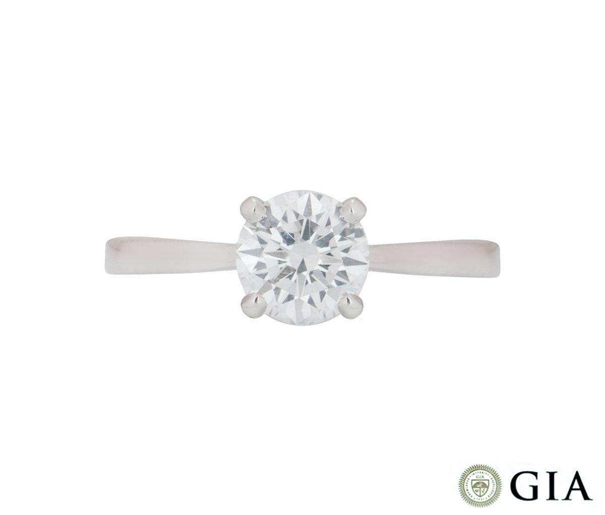 A beautiful 18k white gold diamond engagement ring. The central round brilliant cut diamond weighs 1.04ct, is E colour and VS1 in clarity. The diamond scores an excellent rating in all three aspects for cut, polish and symmetry - this is known as a