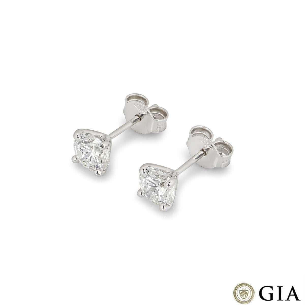 A pair of 18k white gold diamond stud earrings. The earrings feature round brilliant cut diamonds in a 4 claw setting. The diamonds weigh 0.74ct and 0.75ct, both H colour and VS1 clarity. Both diamonds score an excellent rating in all three aspects